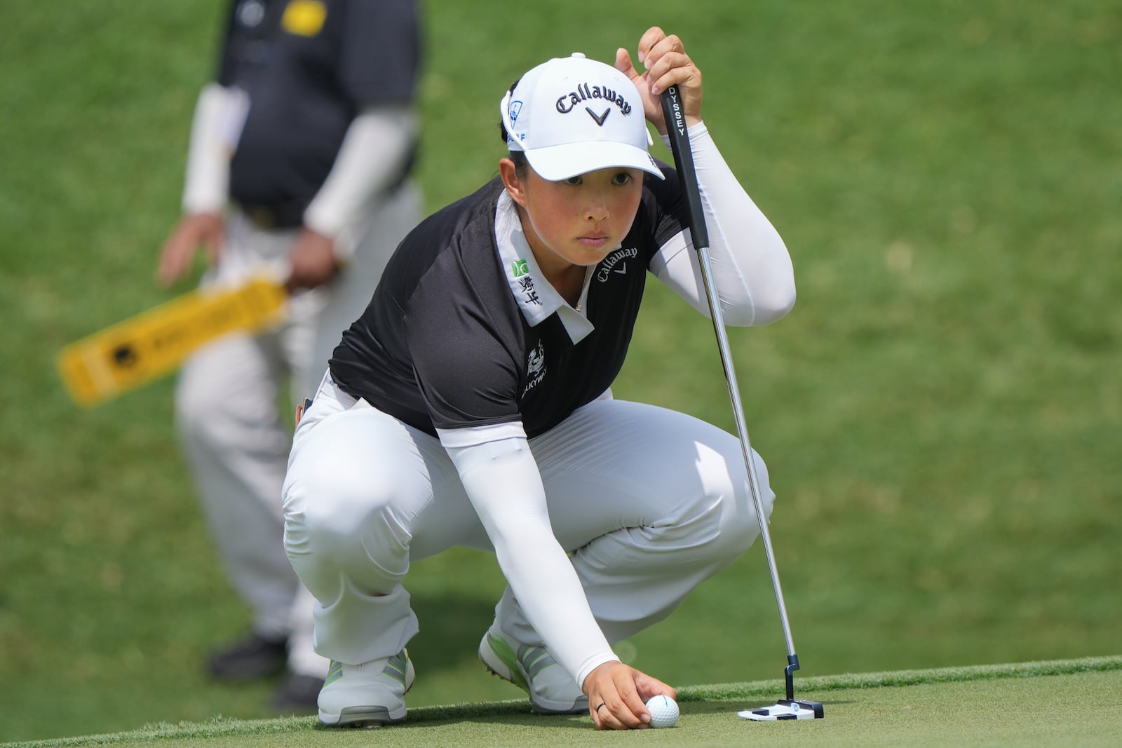 Yin Ruoning of China lines up a putt on on the 17th hole during the LPGA Tour's Maybank Championship at Kuala Lumpur Golf and Country club in Kuala Lumpur, Sunday, Oct. 27, 2024. (AP Photo/Vincent Thian)