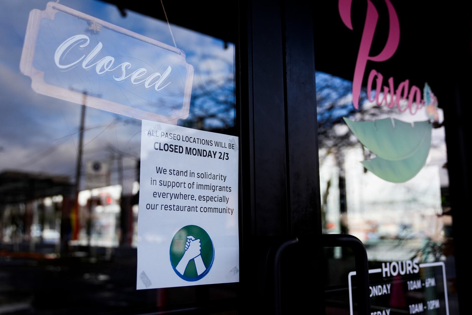 Paseo displays a sign stating the restaurant is closed for the day in solidarity to support the immigrant community, Monday, Feb. 3, 2025, in Seattle. (AP Photo/Lindsey Wasson)