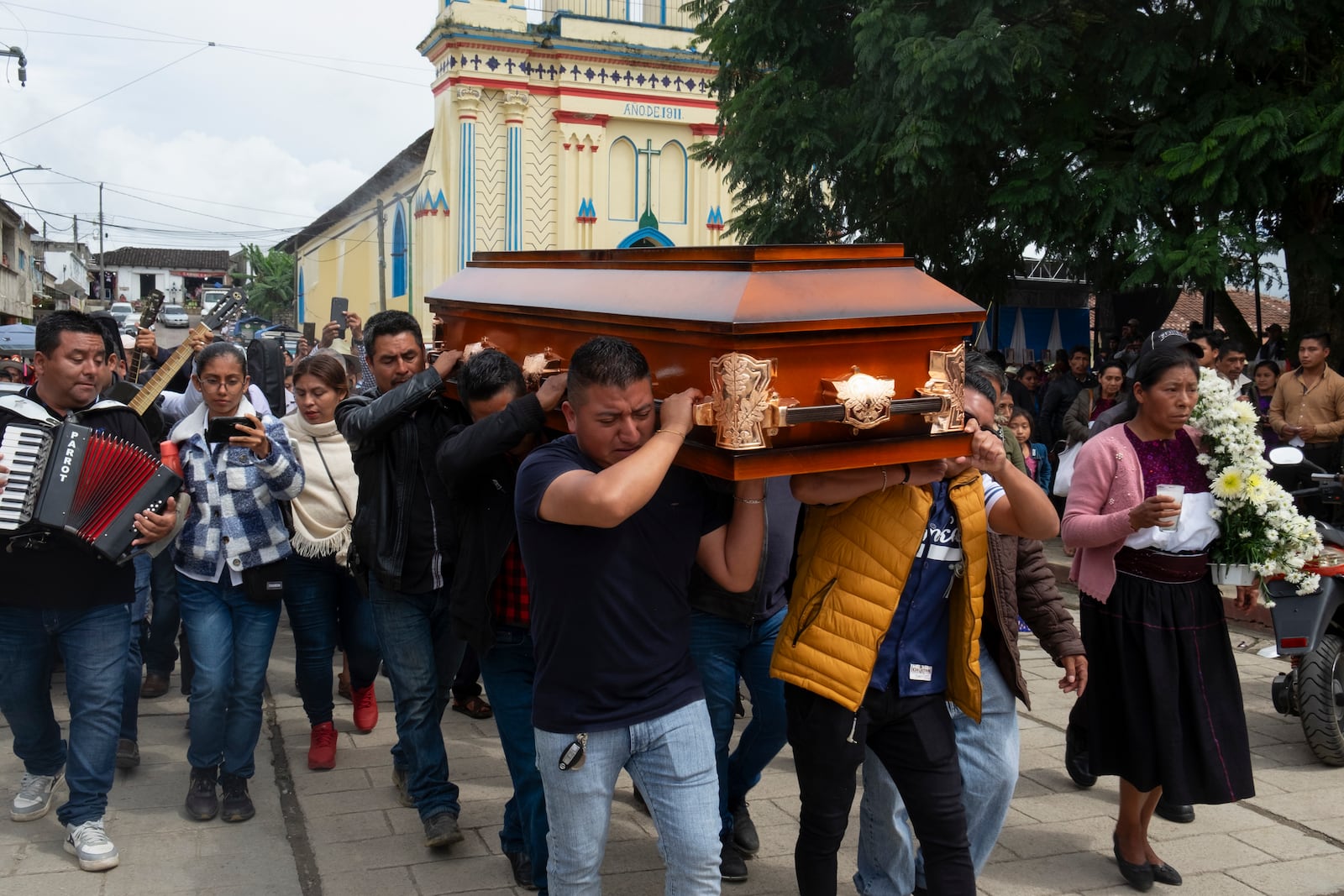 People carry the coffin of slain Catholic priest and activist Marcelo Pérez during a mass at the main plaza in San Andrés Larráinzar, Chiapas state, Mexico, Monday, Oct. 21, 2024. (AP Photo/Isabel Mateos)