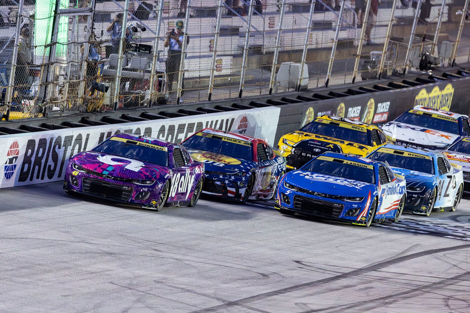 Alex Bowman (48) leads Kyle Larson (5) and Martin Truex Jr. (19) at the start of a NASCAR Cup Series auto race, Saturday, Sept. 21, 2024, in Bristol, Tenn. (AP Photo/Wade Payne)