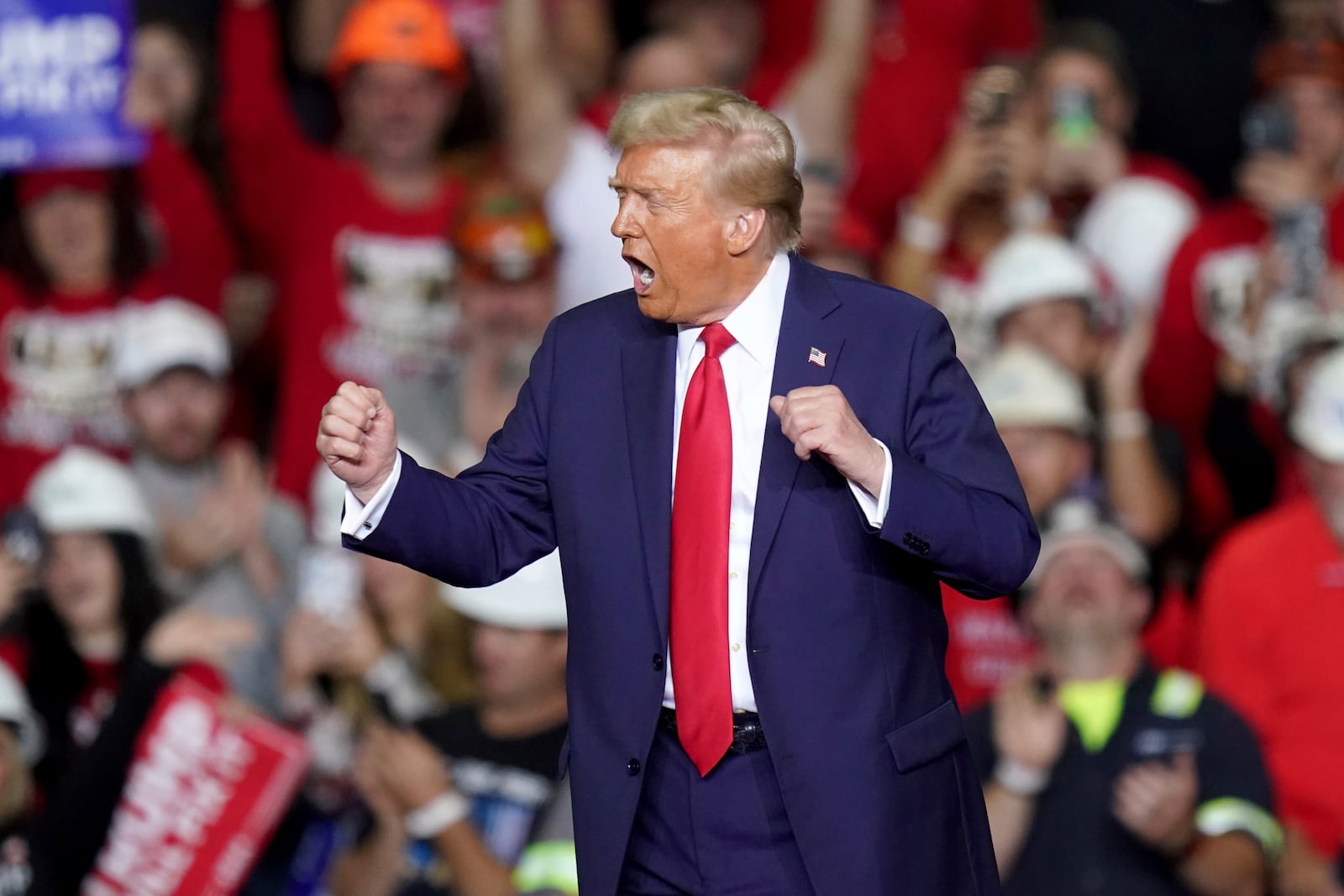 Republican presidential nominee former President Donald Trump dances after speaking at a campaign rally at PPG Paints Arena, Monday, Nov. 4, 2024, in Pittsburgh. (AP Photo/Matt Freed)