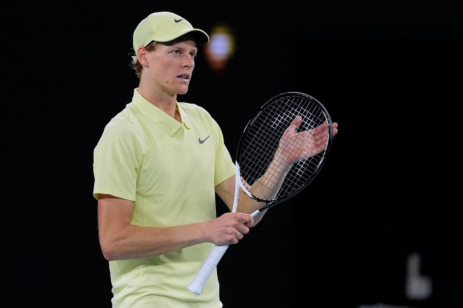 Jannik Sinner of Italy reacts after defeating Marcos Giron of the U.S. in their third round match at the Australian Open tennis championship in Melbourne, Australia, Saturday, Jan. 18, 2025. (AP Photo/Asanka Brendon Ratnayake)