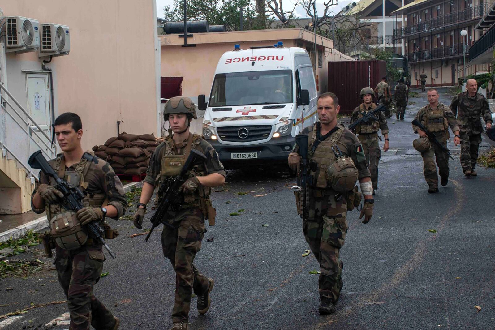 This photo provided Sunday Dec.15, 2024 by the French Army shows soldiers patrolling in the French territory of Mayotte in the Indian Ocean, after Cyclone Chido caused extensive damage with reports of several fatalities. (Etat Major des Armées via AP)