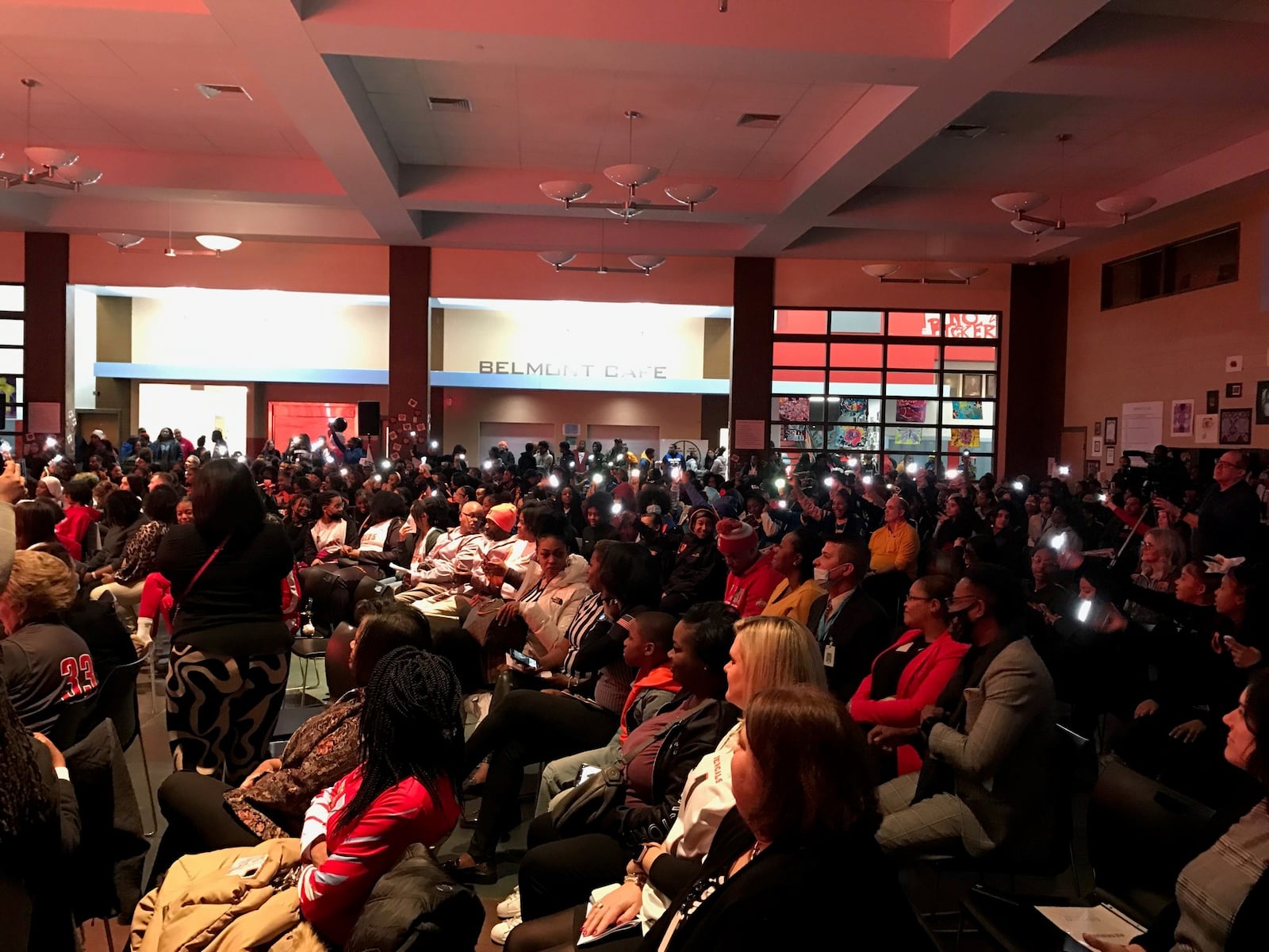 Many in the crowd of some 400 female student athletes from Dayton’s six public high schools, as well as a few from Trotwood Madison and Springfield Catholic Central, waved their camera lights and sang along to Jill Scott’s song “Golden,” which opened the “Who’s in the Jersey” program put on by Dayton Public Schools Athletics on National Girls & Women in Sports Day at Belmont High School. Tom Archdeacon/CONTRIBUTED