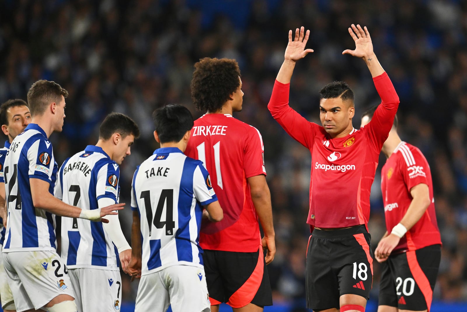 Manchester United's Casemiro, right, reacts during the Europa League round of 16 first leg soccer match between Real Sociedad and Manchester United at the Reale Arena in San Sebastian, Spain, Thursday, March 6, 2025. (AP Photo/Miguel Oses)