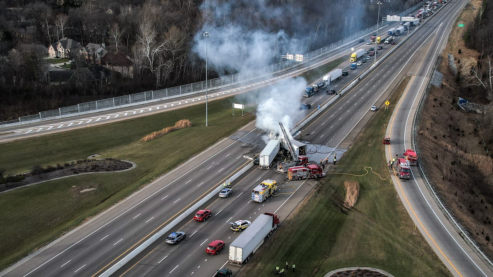 A fiery crash involving two semis and two cars shut down both directions of Interstate 75 near I-70 on Friday afternoon, Dec. 2, 2022. JIM NOELKER/STAFF