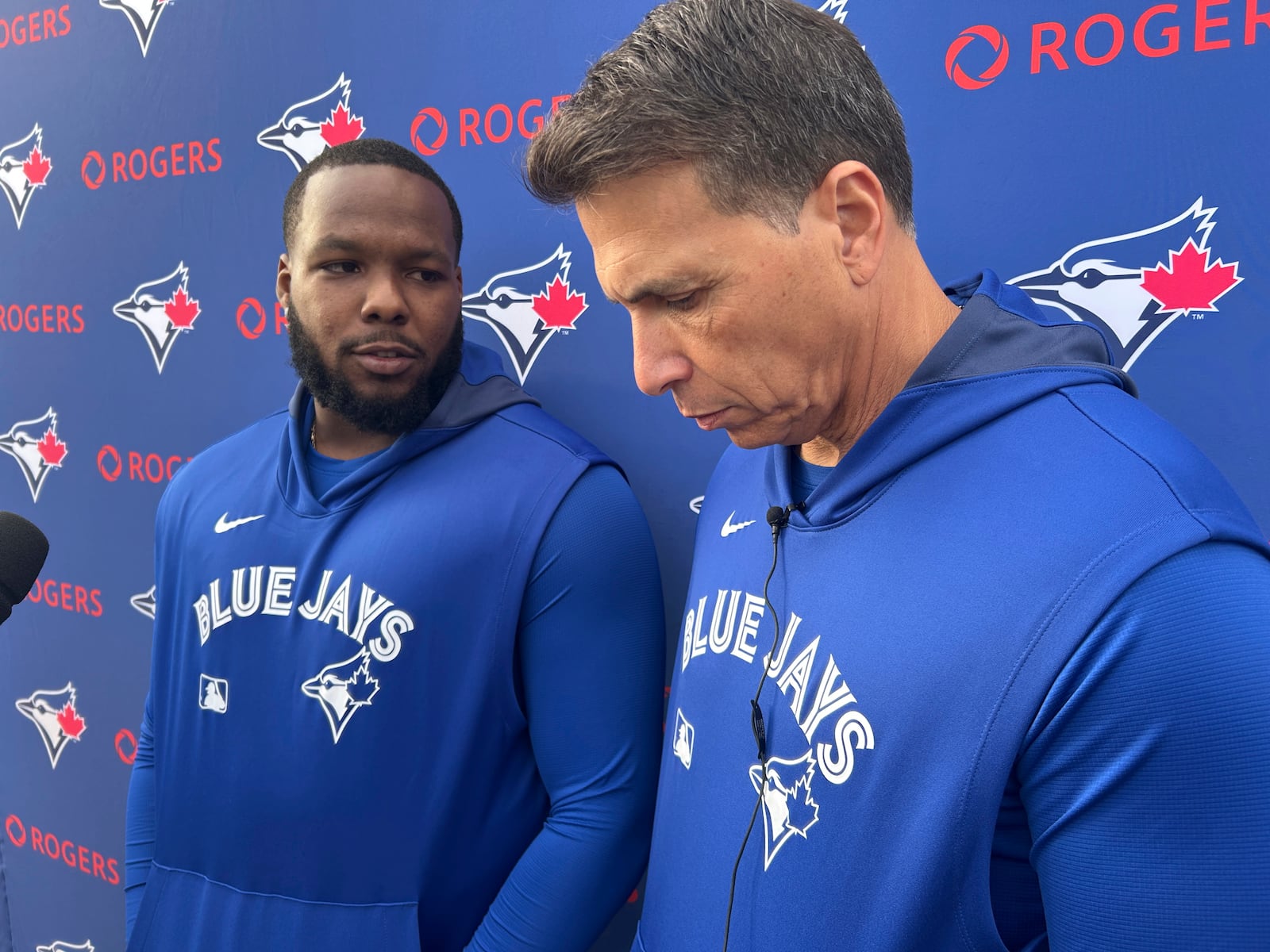 Toronto Blue Jays' Vladimir Guerrero Jr. talks to media in Dunedin, Fla. on Tuesday, Feb. 18, 2025 as interpreter Hector Lebron looks on. Guerrero Jr. told reporters in Dunedin, Fla. that he and the team have not reached an agreement on a contract extension. (Greg Strong/The Canadian Press via AP)