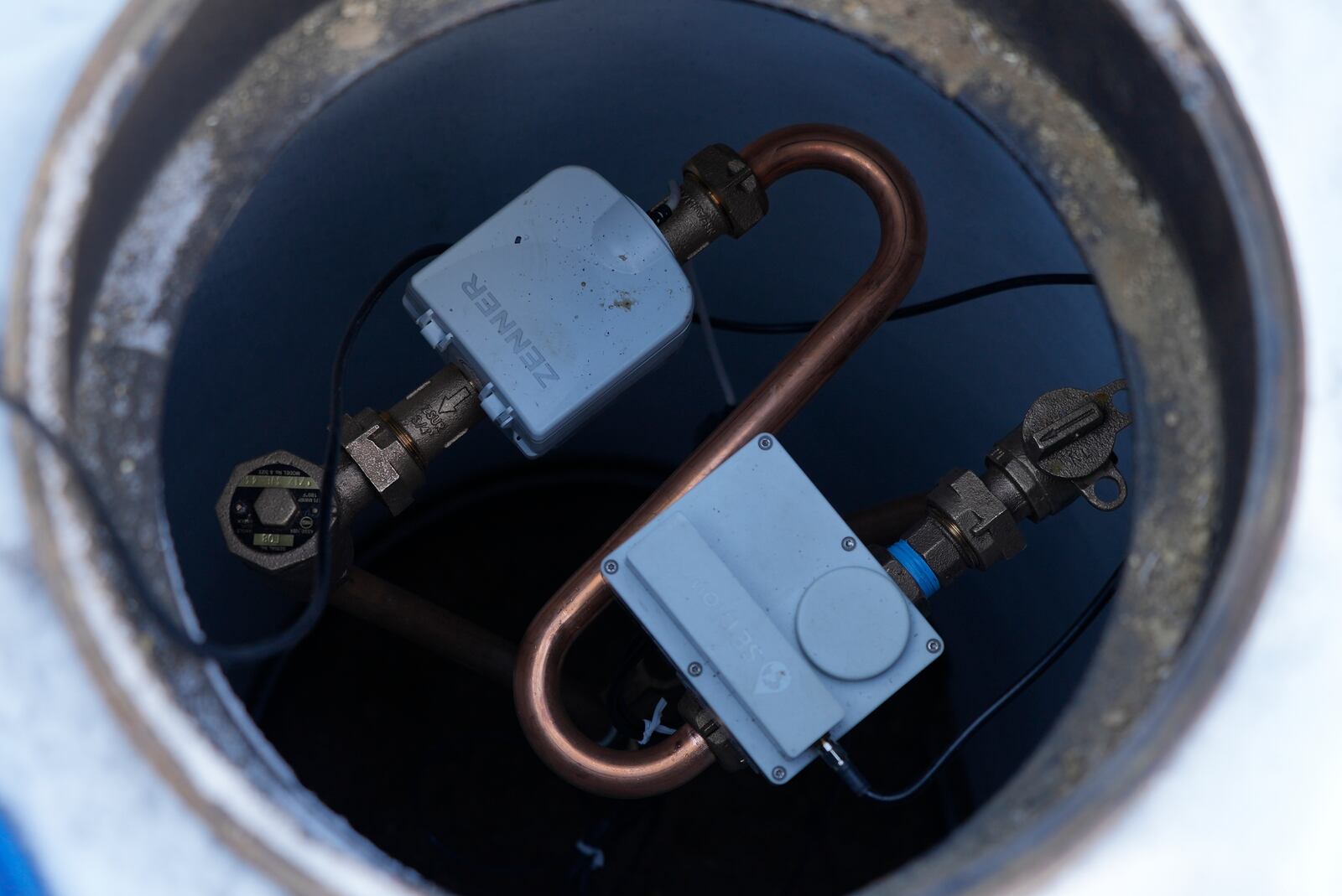 A new water meter with a remote shut off valve is installed on Thursday, Feb. 13, 2025, in Louisville, Colo. (AP Photo/Brittany Peterson)