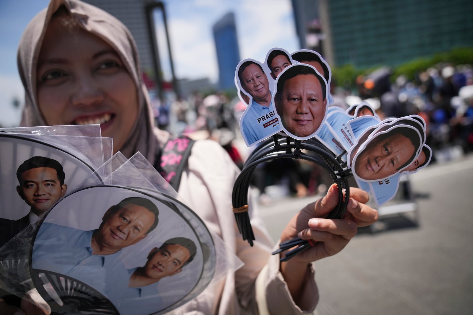 Indonesian sales souvenir with picture of Newly-inaugurated Indonesian President Prabowo Subianto in Jakarta, Indonesia, Sunday, Oct. 20, 2024. (AP Photo/Dita Alangkara)