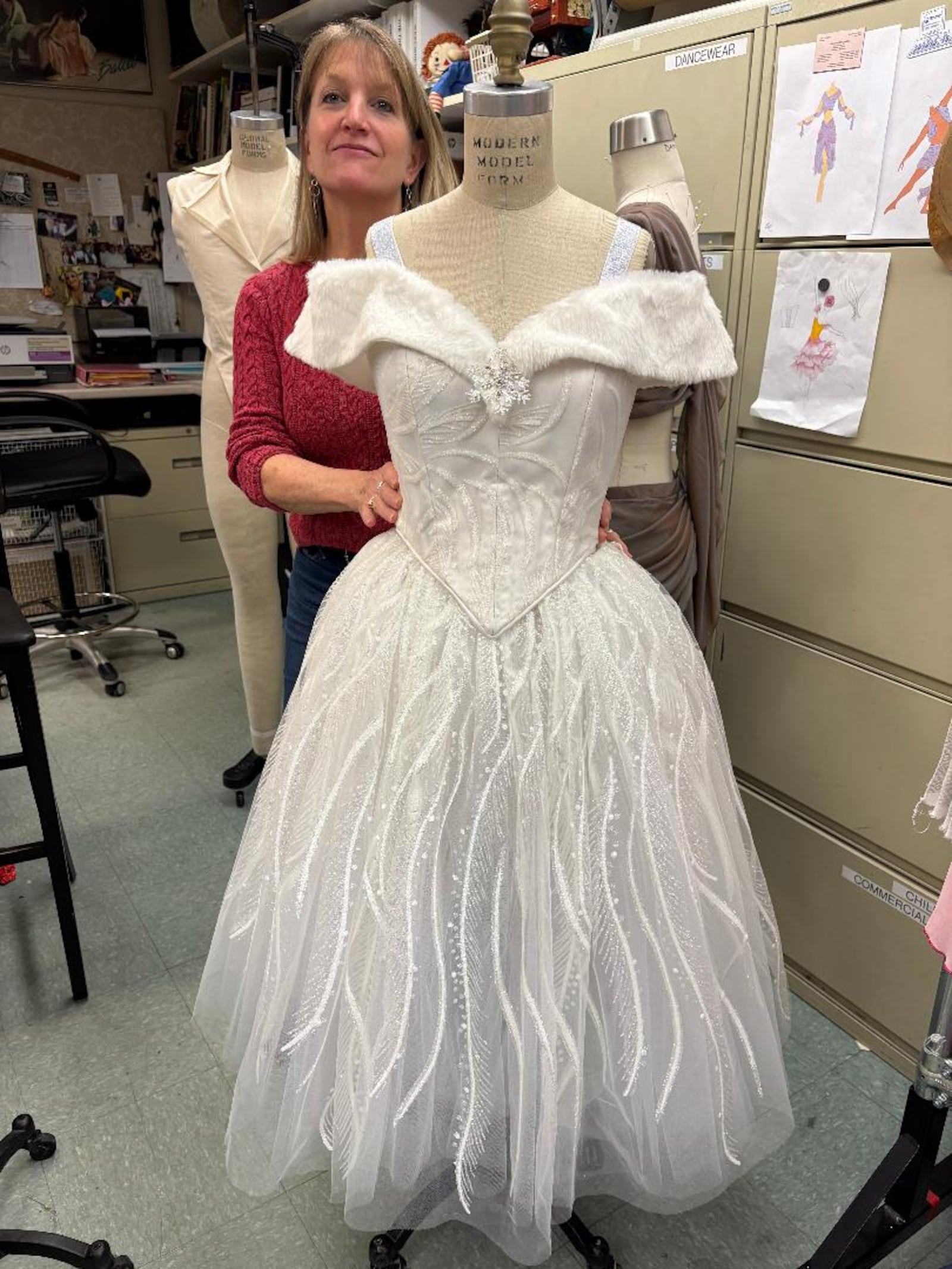 Designer Lyn Baudendistel showcases one of her snow corps costumes for the Dayton Ballet's production of "The Nutcracker." PHOTO BY RUSSELL FLORENCE JR.