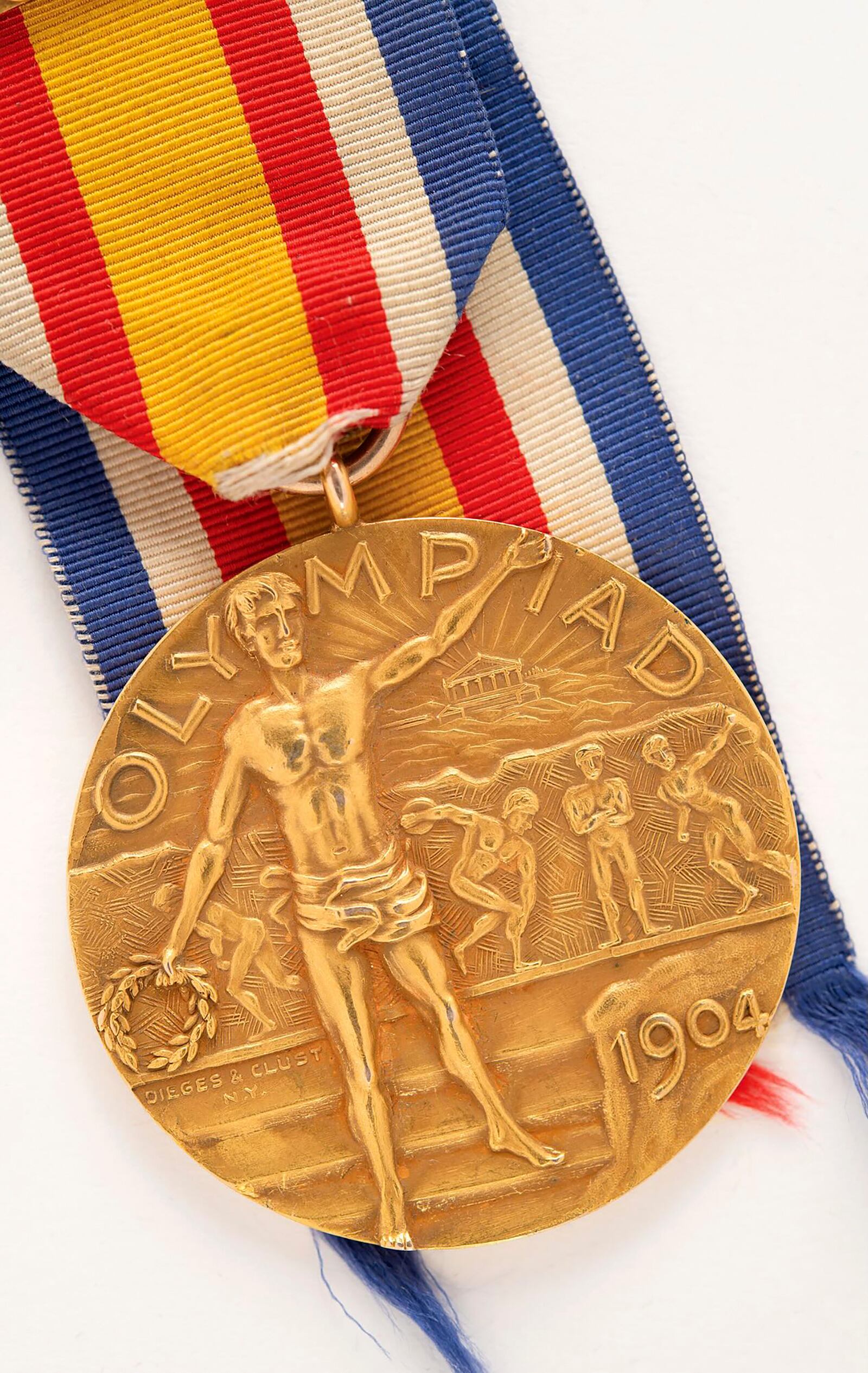 This Nov. 2024 image provided by RR Auction shows a rare gold medal from the 1904 Olympics at the intake office of RR Auction, in Amherst, N.H. (RR Auction via AP)