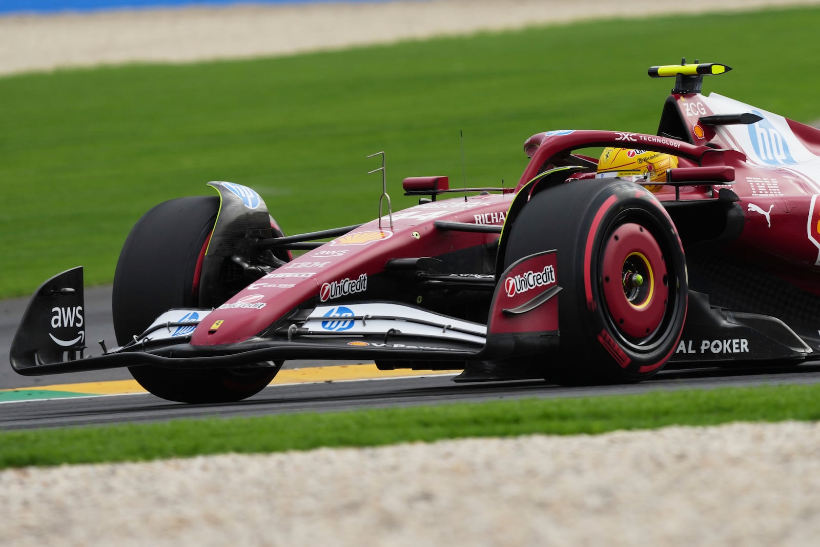 Ferrari driver Lewis Hamilton of Britain steers his car during qualifying at the Australian Formula One Grand Prix at Albert Park, in Melbourne, Australia, Saturday, March 15, 2025. (AP Photo/Heath McKinley )