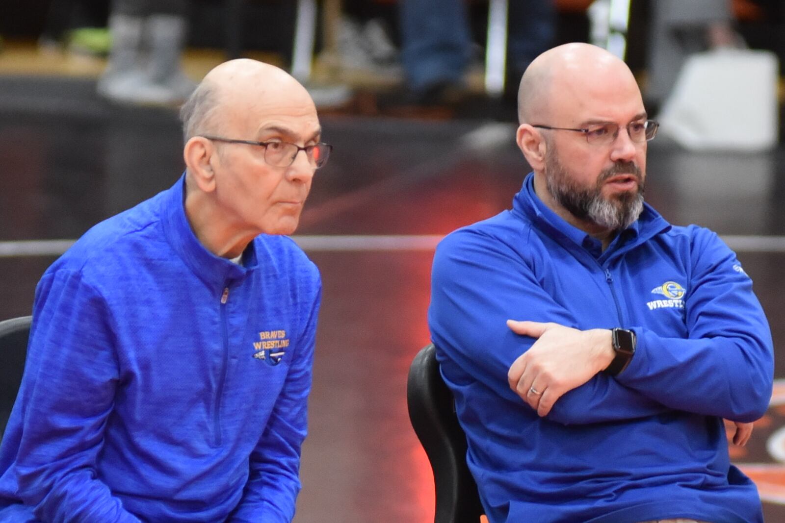 Stamat Bulugaris, left, and his son Mike, watch a match at Olentangy High School, where Mike is an assistant coach, last season.