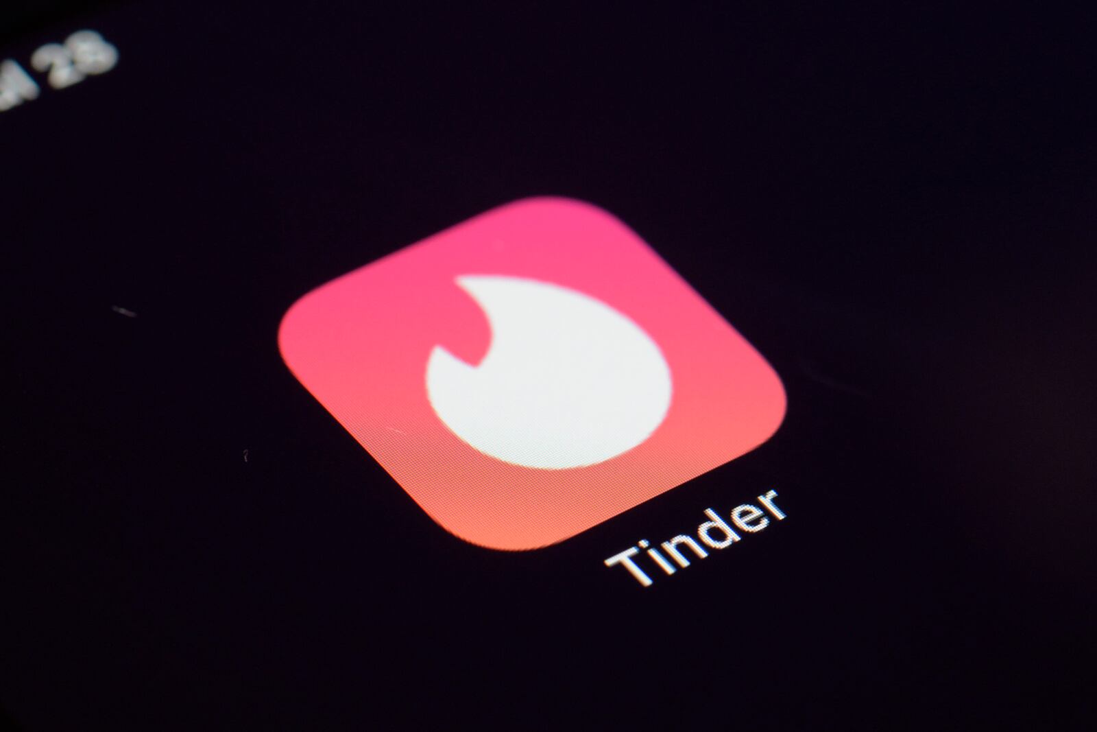 FILE - The icon for the dating app Tinder appears on a device, July 28, 2020, in New York. (AP Photo/Patrick Sison, File)