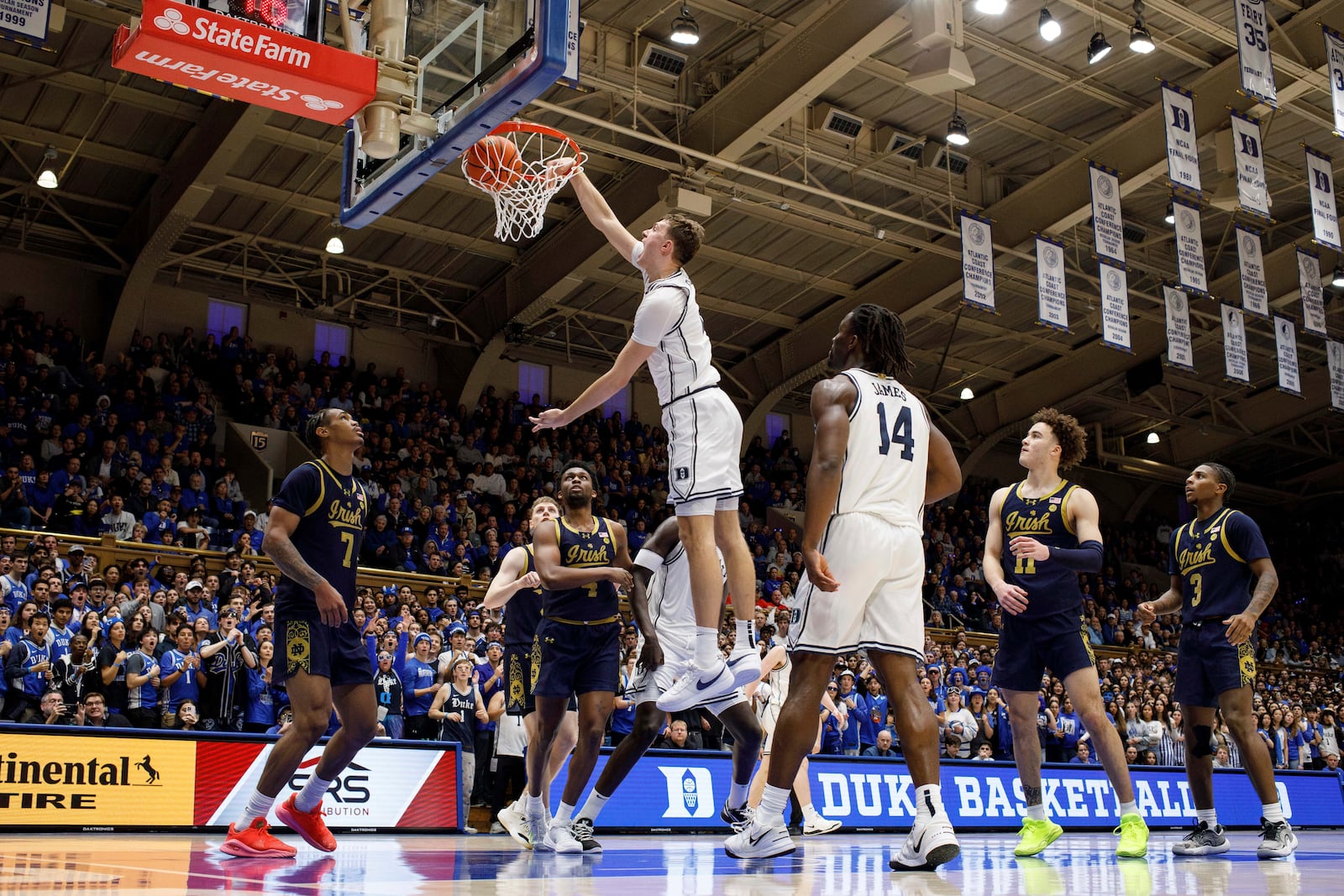 Duke's Cooper Flagg (2) dunks during the second half of an NCAA college basketball game against Notre Dame in Durham, N.C., Saturday, Jan. 11, 2025. (AP Photo/Ben McKeown)