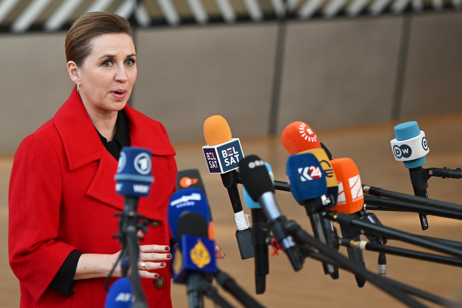 Denmark's Prime Minister Mette Frederiksen speaks withe the media as she arrives for an EU Summit at the European Council building in Brussels, Thursday, March 6, 2025. (AP Photo/Harry Nakos)