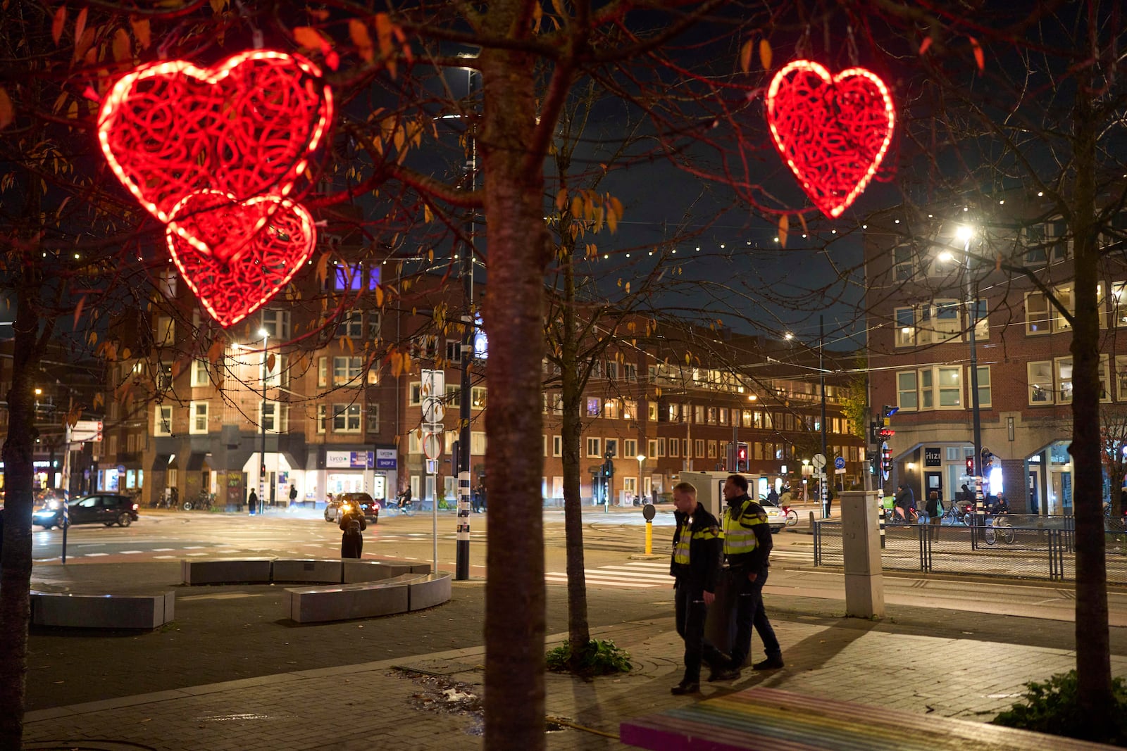 Police officers are seen patrolling the streets in Amsterdam, Netherlands, Tuesday, Nov. 12, 2024, as the city is facing tensions following violence last week. (AP Photo/Bram Janssen)