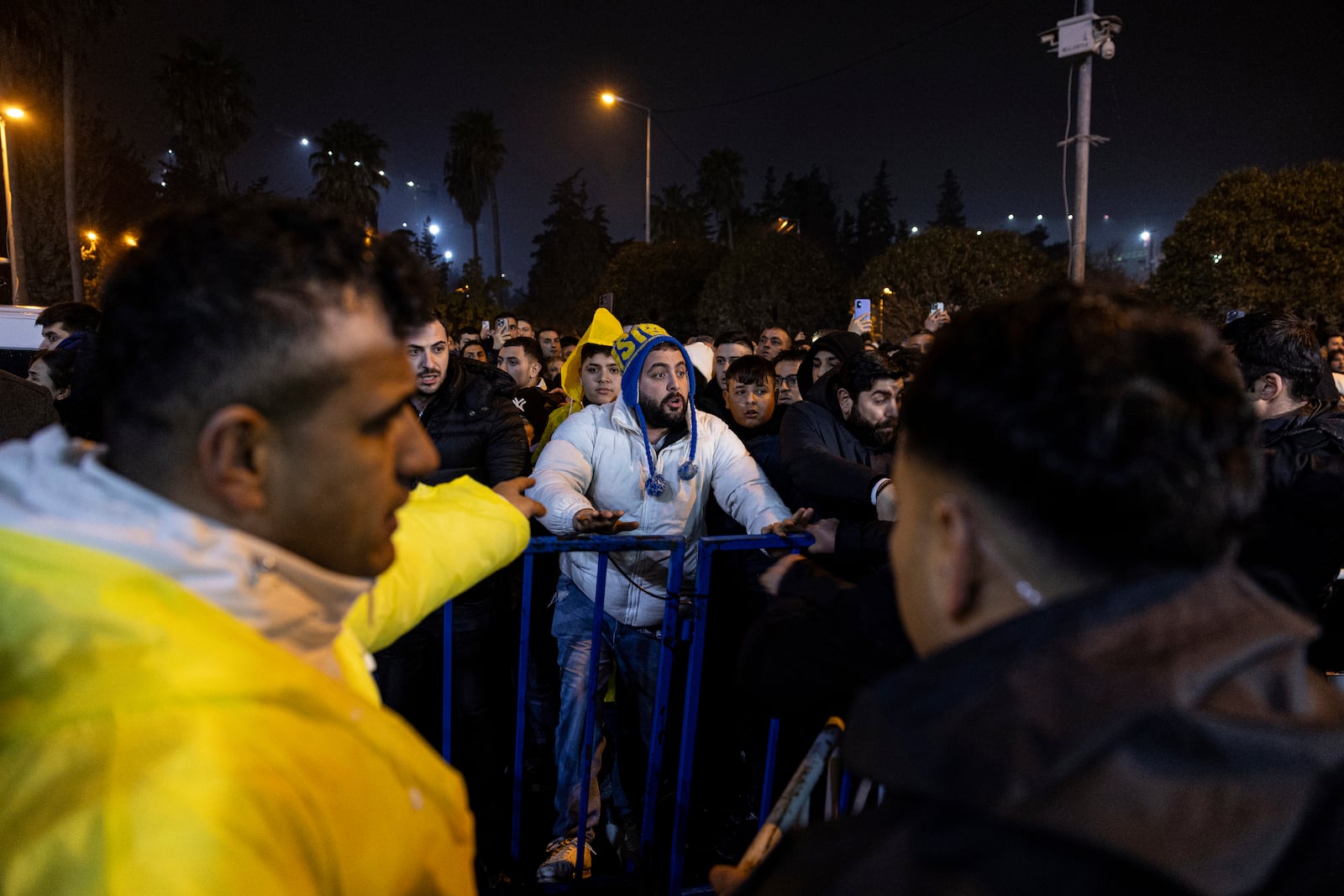 A man argues with policemen as people are blocked while gathering to mark the two-year anniversary of the country's catastrophic earthquake, in Antakya, southern Turkey, early Thursday, Feb. 6, 2025. (Ugur Yildirim/Dia Photo via AP)