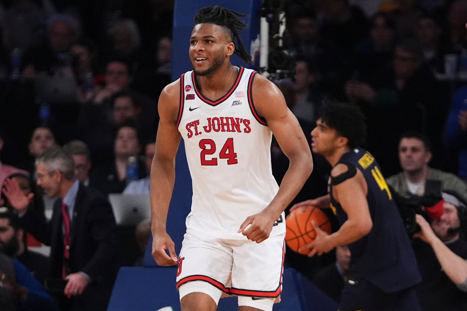 St. John's's Zuby Ejiofor (24) smiles after scoring during the second half of an NCAA college basketball game against the Marquette in the semifinals of the Big East tournament Friday, March 14, 2025, in New York. (AP Photo/Frank Franklin II)