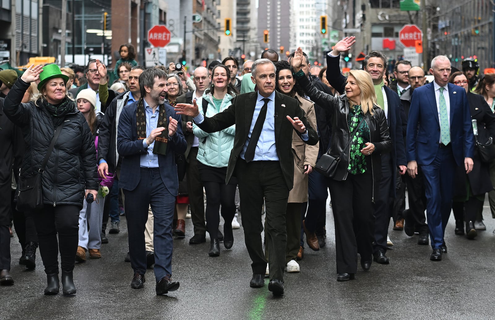 Prime Minister Mark Carney, centre, attends the annual St. Patrick's Day Parade in Montreal, Sunday, March 16, 2025.(Graham Hughes /The Canadian Press via AP)