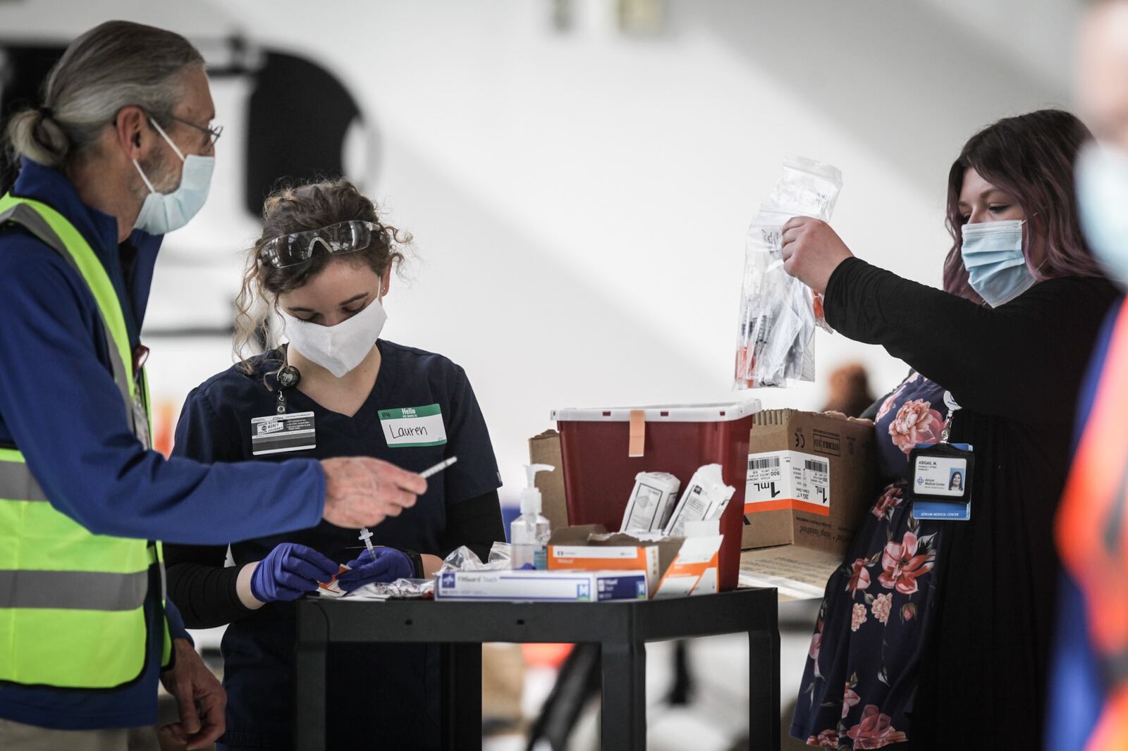 Premier Health workers prepare to vaccinate people from COVID-19 at an clinic held at the University of Dayton Arena Monday March 22, 2021.