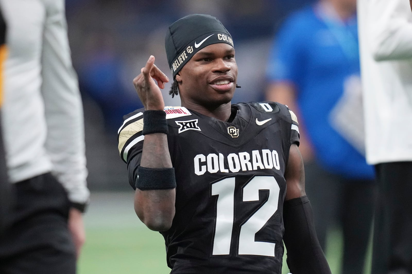 FILE - Colorado wide receiver Travis Hunter (12) warms up for the Alamo Bowl NCAA college football game against BYU, Dec. 28, 2024, in San Antonio. (AP Photo/Eric Gay, File)