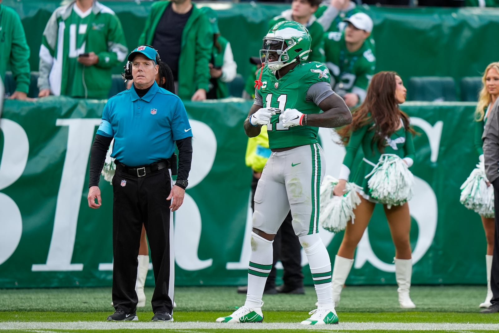 Philadelphia Eagles wide receiver A.J. Brown (11) gestures toward the stands after realizing the football he launched onto the stands is quarterback Tanner McKee's first career touchdown during the second half of an NFL football game against the Dallas Cowboys, Sunday, Dec. 29, 2024, in Philadelphia. (AP Photo/Chris Szagola)