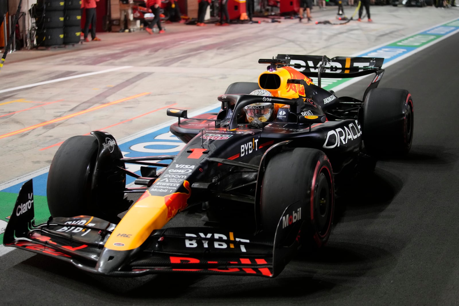 Red Bull driver Max Verstappen of the Netherlands at pit stop during the qualifying race at the Formula One Qatar Grand Prix, at the Lusail International Circuit in Lusail, Qatar, Saturday, Nov. 30, 2024. (AP Photo/ Darko Bandic, Pool)