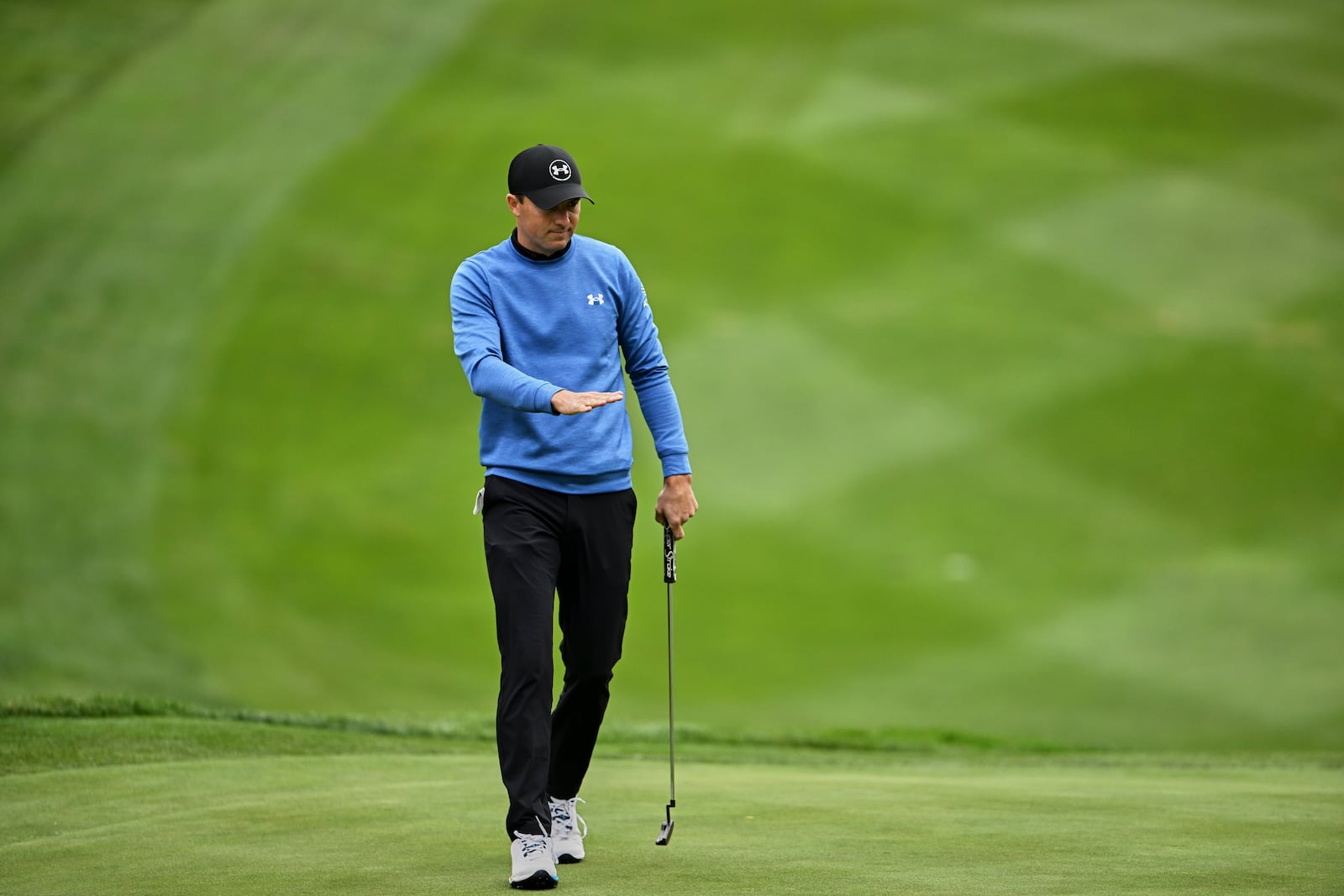 Jordan Spieth watches his putt on the 16th hole at Spyglass Hill Golf Course during the first round of the AT&T Pebble Beach Pro-Am golf tournament, Thursday, Jan. 30, 2025, in Pebble Beach, Calif. (AP Photo/Nic Coury)