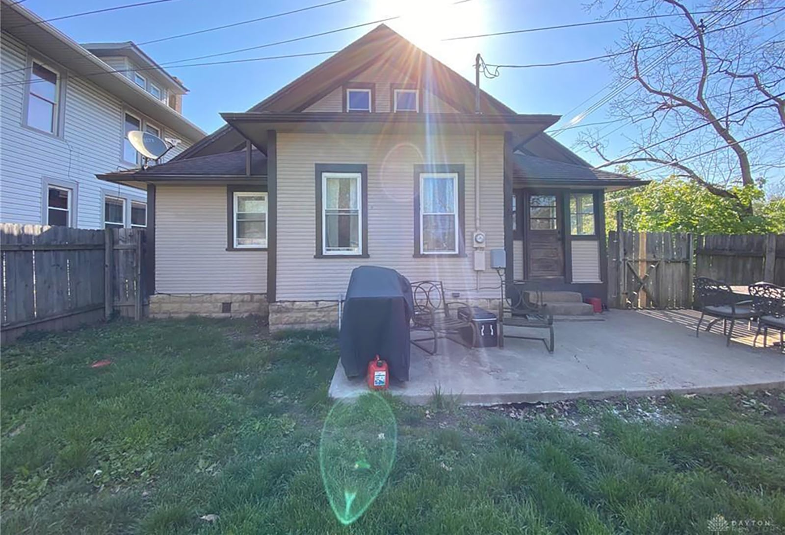 A concrete patio in back of the home, and there is stone trim on the house. The back yard is surrounded by a wood privacy fence. The property includes a detached, 2-car garage. CONTRIBUTED PHOTO