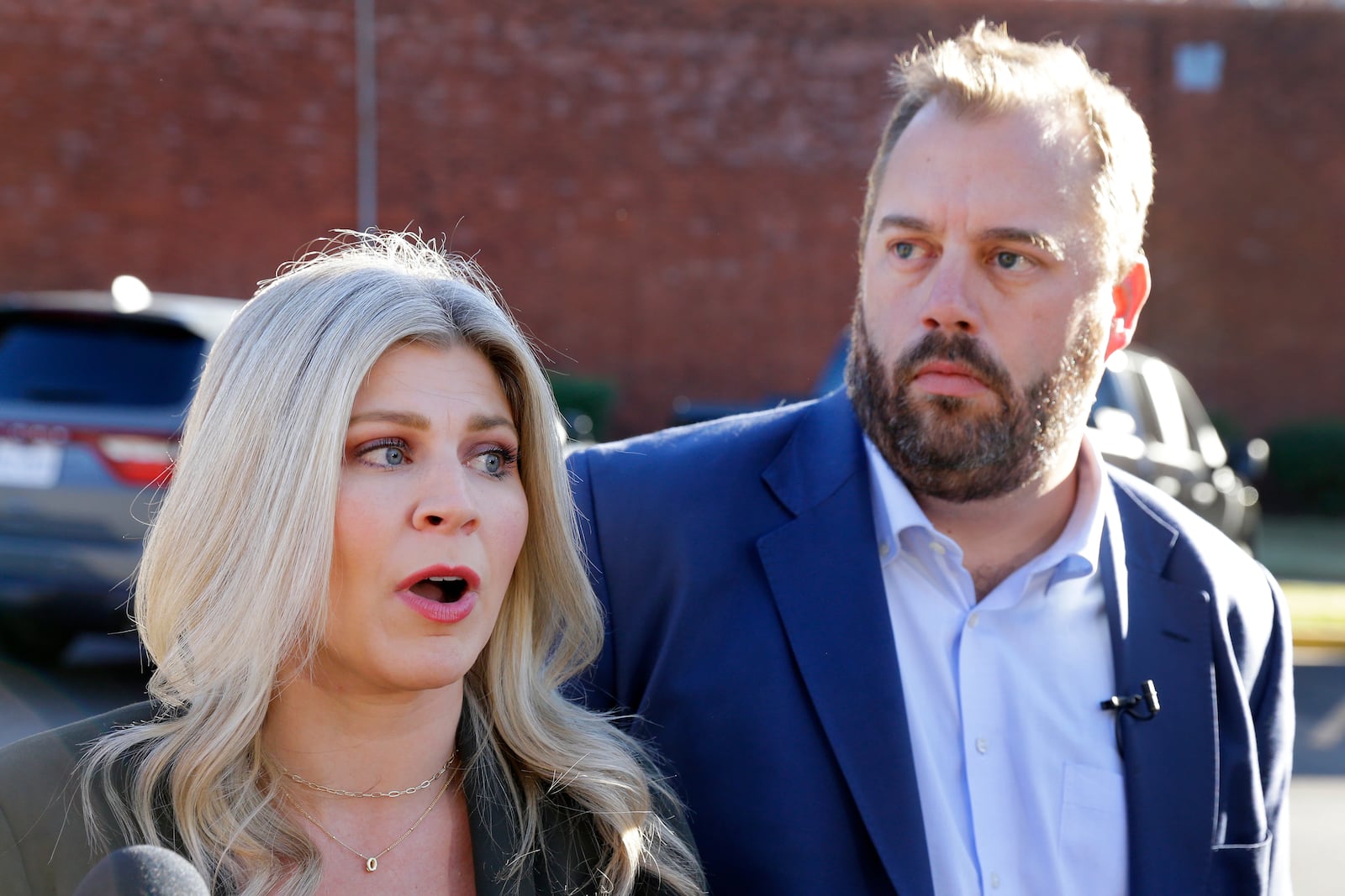 Texas state representatives Lacey Hull, left, and John Bucy III, speak to reporters on the pending execution of Robert Roberson during an impromptu press conference outside of the Huntsville Unit of the Texas State Penitentiary, Thursday, Oct. 17, 2024, in Huntsville, Texas. (AP Photo/Michael Wyke)