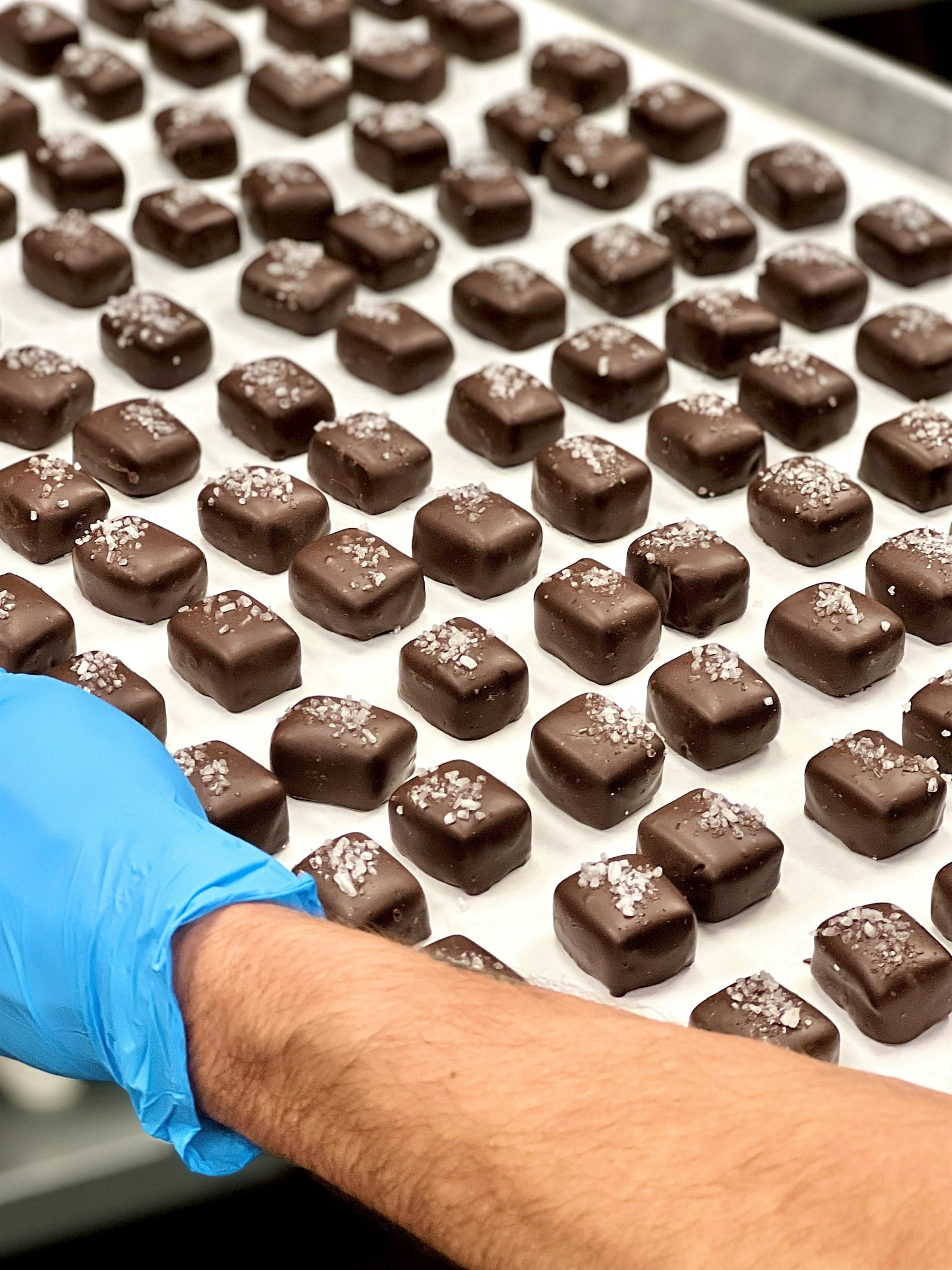 WInans Chocolates + Coffee continues to use the original chocolate recipes handed down through the generations. Wilson Reiser joined the company full time in 2020 just after the COVID-19 outbreak began. Here are the company's sea salt caramels.