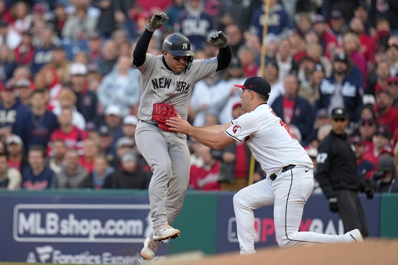 New York Yankees' Jose Trevino, left, is tagged out by Cleveland Guardians starting pitcher Matthew Boyd during the second inning in Game 3 of the baseball AL Championship Series Thursday, Oct. 17, 2024, in Cleveland.(AP Photo/Jeff Roberson)