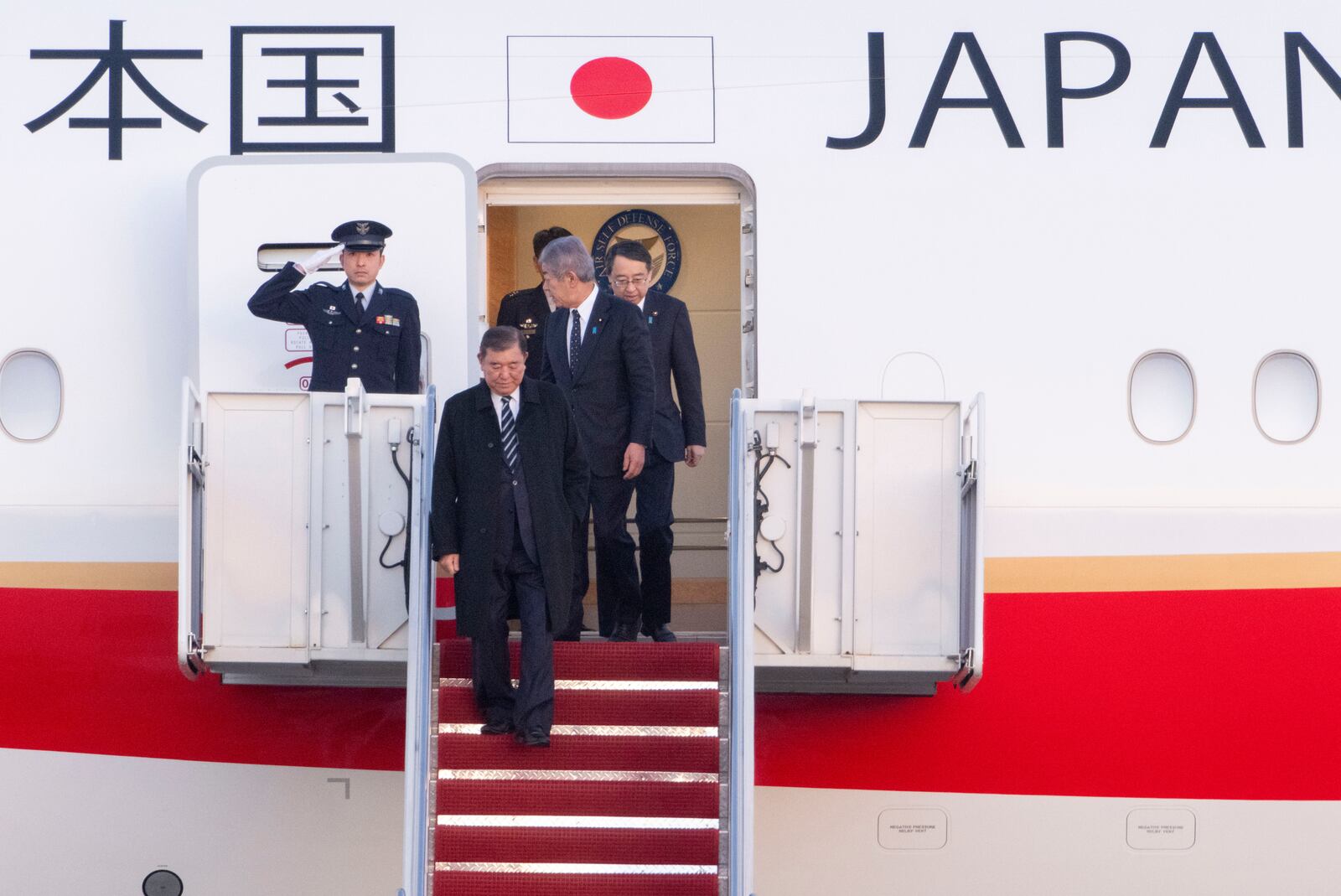 Japan's Prime Minister Shigeru Ishiba arrives at Joint Base Andrews, Md., Thursday, Feb. 6, 2025. (AP Photo/Kevin Wolf)