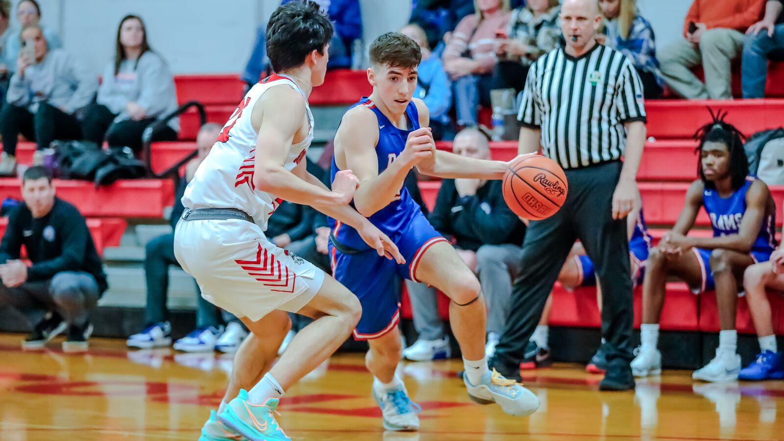 Greeneview High School senior Chase Allen is guarded by Southeastern senior Cole Walton during their game on Tuesday night in South Charleston. The Trojans won 58-44. Michael Cooper/CONTRIBUTED