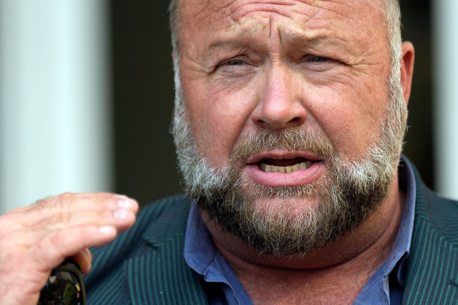 FILE - Right-wing conspiracy theorist Alex Jones speaks outside the federal courthouse after a bankruptcy hearing Friday, June 14, 2024, in Houston. (AP Photo/David J. Phillip, File)