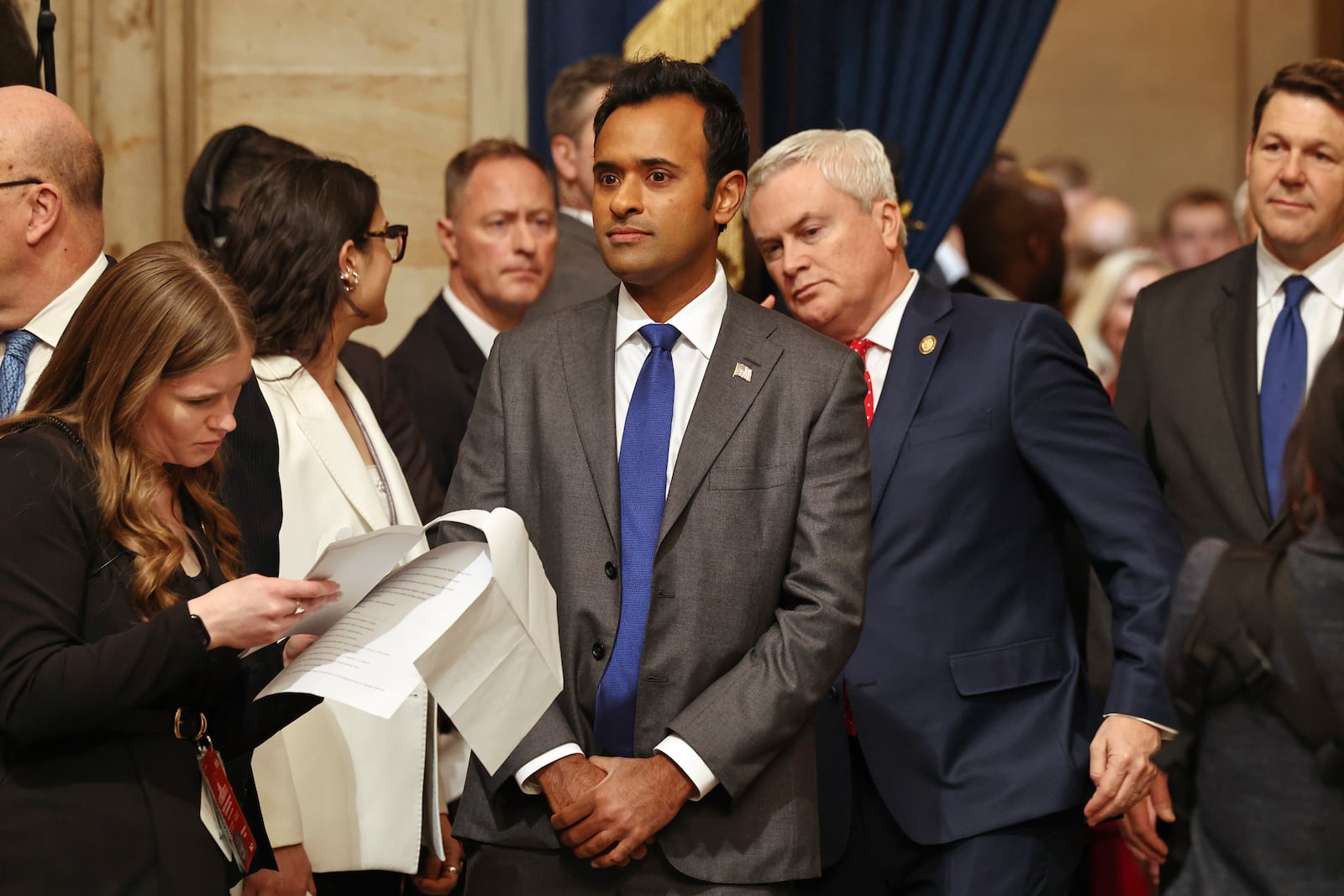 Vivek Ramaswamy, center, arrives before the 60th Presidential Inauguration in the Rotunda of the U.S. Capitol in Washington, Monday, Jan. 20, 2025. (Chip Somodevilla/Pool Photo via AP)