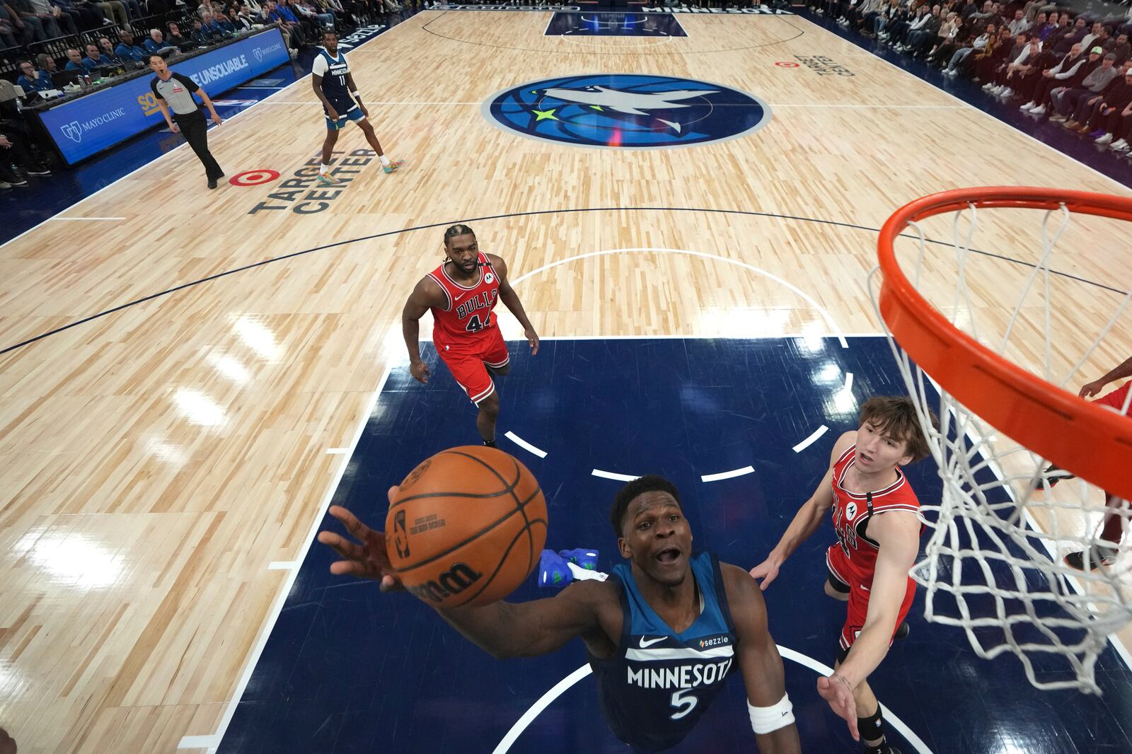 Minnesota Timberwolves guard Anthony Edwards (5) goes up for a shot during the first half of an NBA basketball game against the Chicago Bulls, Wednesday, Feb. 5, 2025, in Minneapolis. (AP Photo/Abbie Parr)