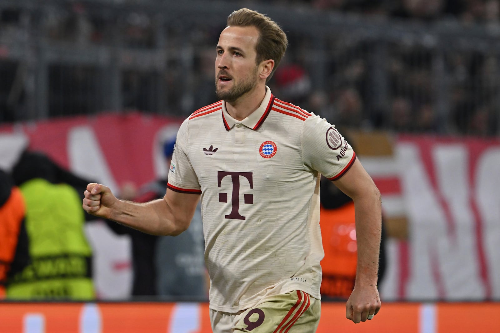 Munich's Harry Kane celebrates after scoring his side's third goal during the Champions League round of 16 first leg soccer match between FC Bayern Munich and Bayer 04 Leverkusen in Munich, Germany, Wednesday, March 5, 2025. (Peter Kneffel/dpa via AP)