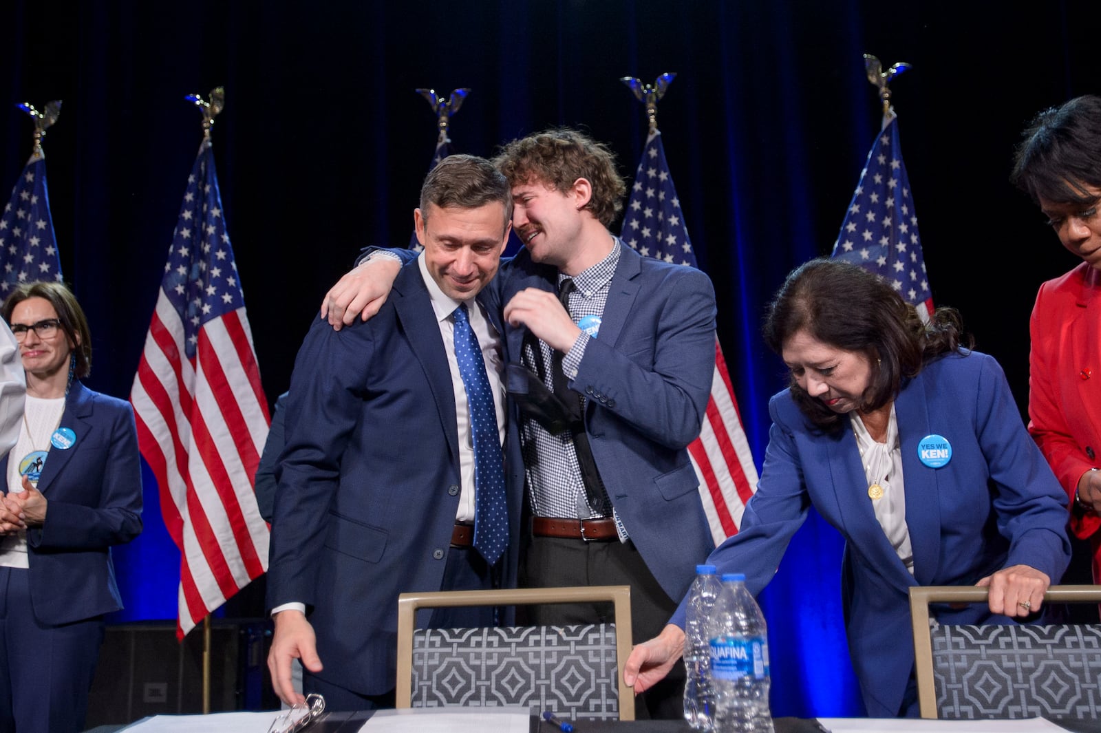 Newly elected Democratic National Committee Chairman Ken Martinfrom left, is hugged by his son Sam after winning the vote at the Democratic National Committee Winter Meeting at the Gaylord National Resort and Convention Center in National Harbor, Md., Saturday, Feb. 1, 2025. (AP Photo/Rod Lamkey, Jr.)