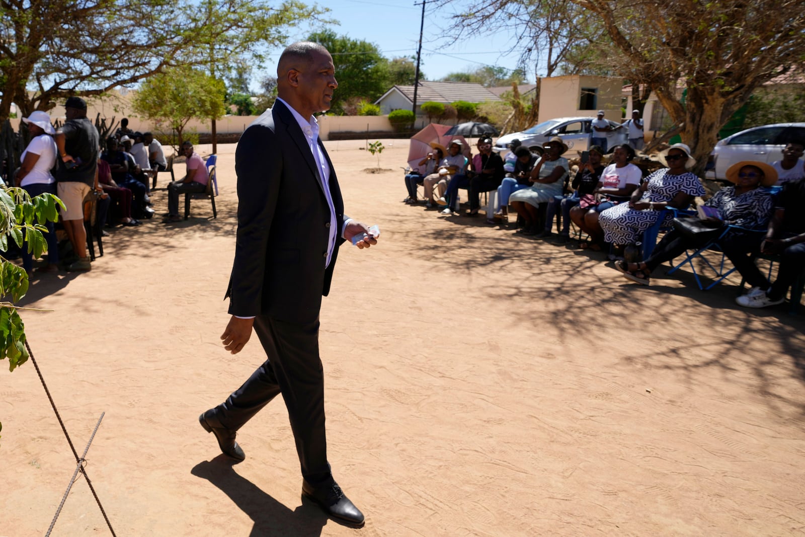 Umbrella for Democratic Change (UDC) presidential candidate Duma Boko leaves the voting station after casting his vote during the elections in Gaborone, Botswana, Wednesday, Oct. 30, 2024. (AP Photo/Themba Hadebe)