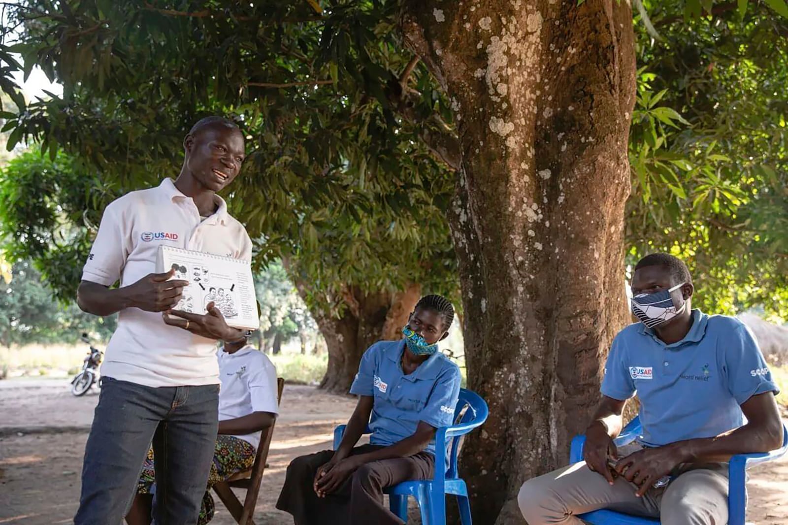 This photo provided by World Relief shows care group volunteers, who provide community health education, meeting in January 2022, in Ibba, South Sudan. (Esther Mbabazi/World Relief via AP)