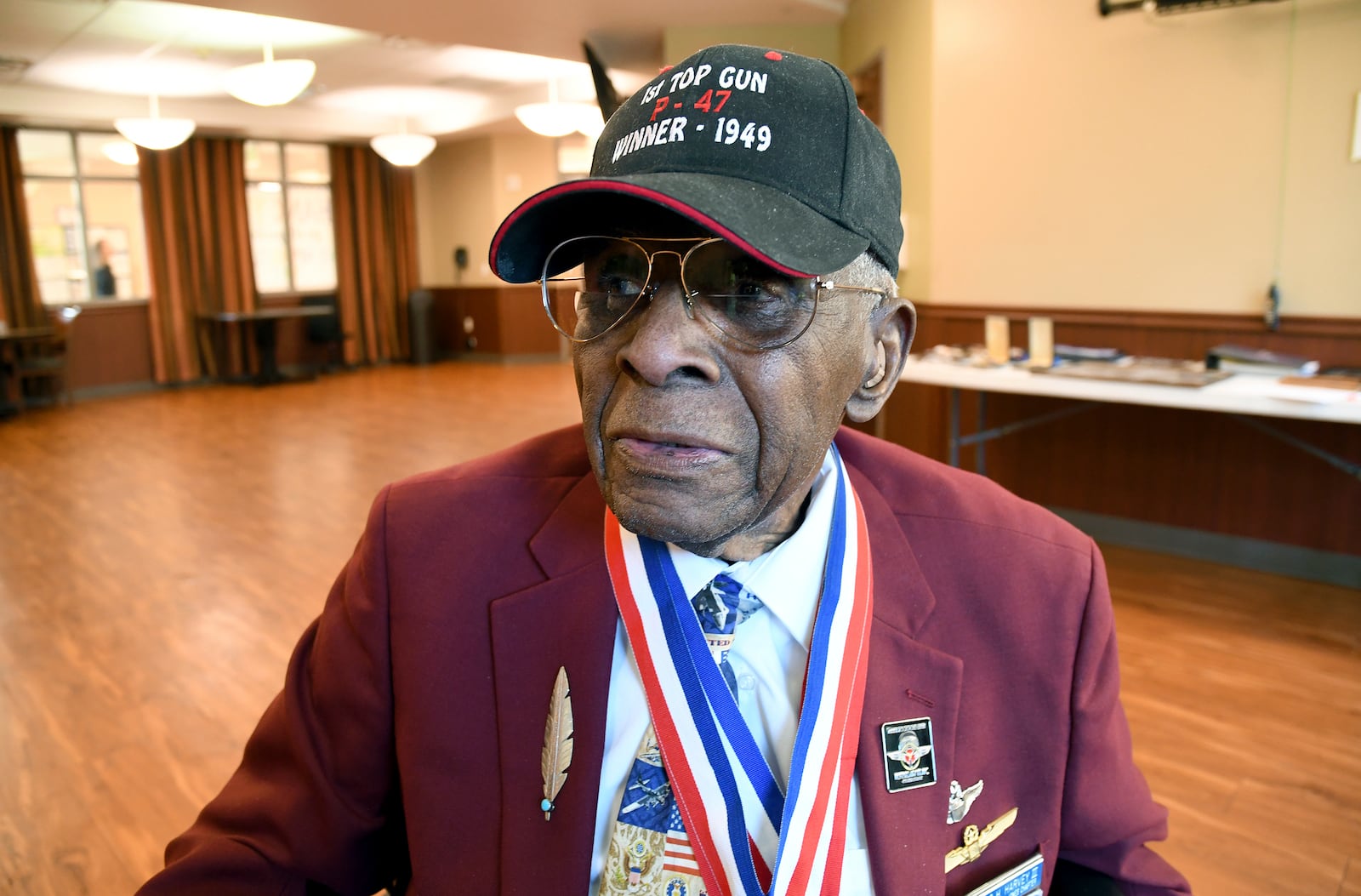 101-year-old Col. James H. Harvey III, one of the last surviving Tuskegee Airmen, sits for a portrait in Aurora, Colo., Wednesday, March 12, 2025. (AP Photo/Thomas Peipert)