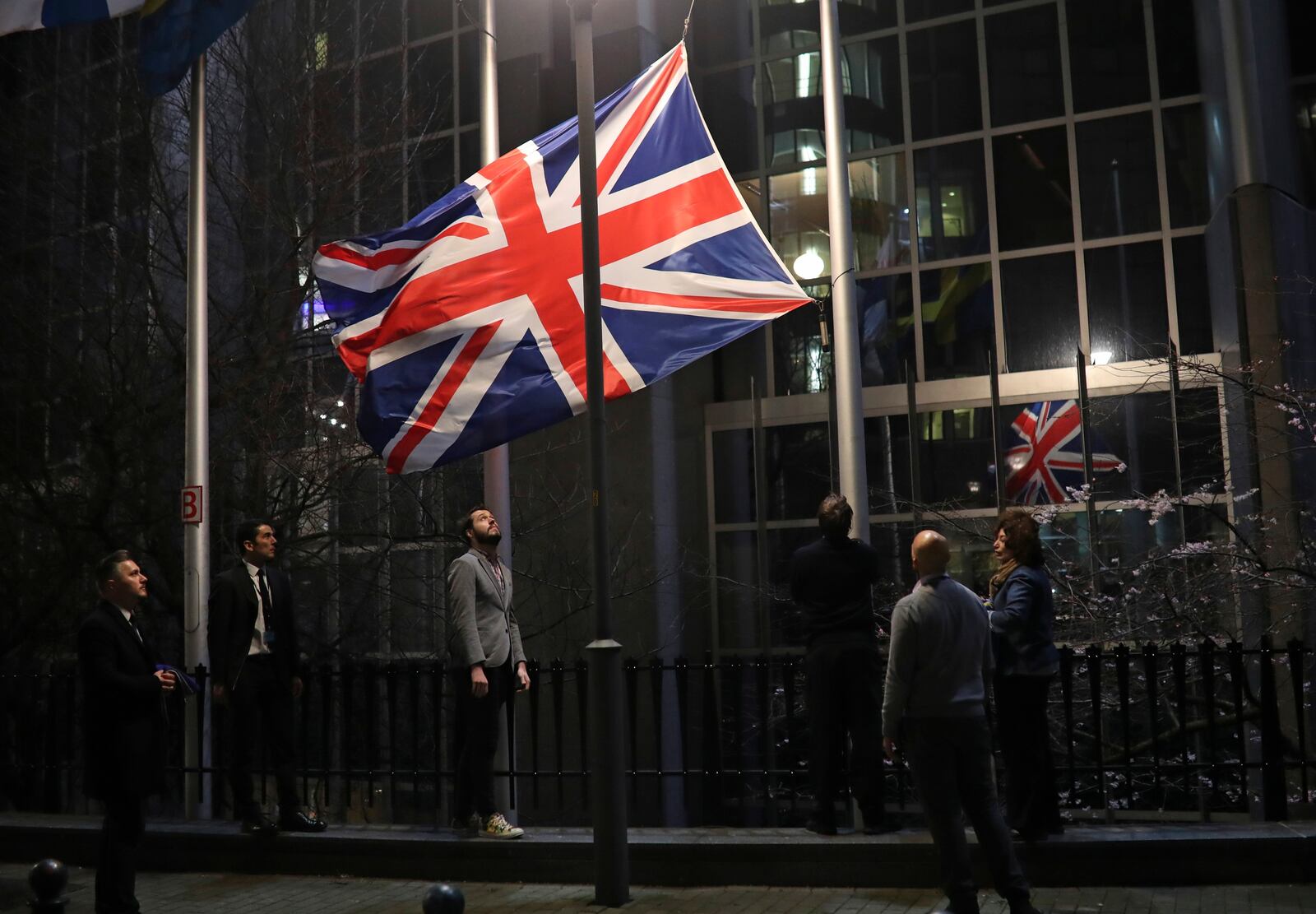 FILE - The Union flag is lowered and removed from outside of the European Parliament in Brussels Friday, Jan. 31, 2020. (AP Photo/Francisco Seco, File)