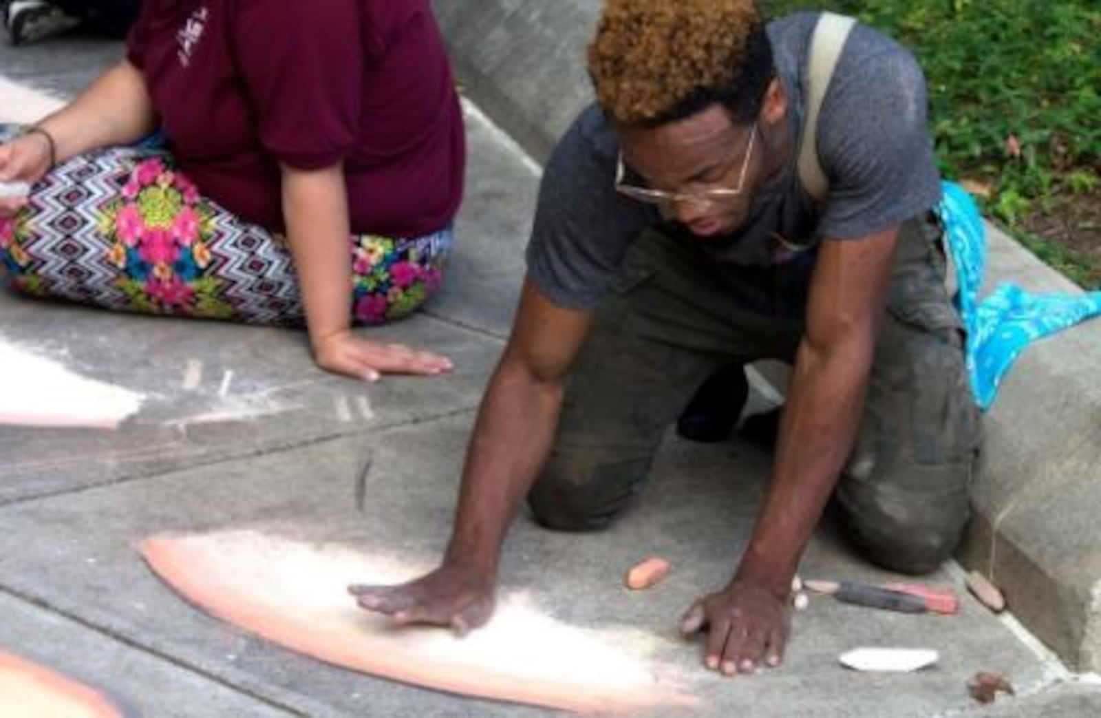 Dayton artist Boy Blue taught several Project Jericho students the possibilities of sidewalk chalk pastels as art over the summer and will be on hand at the first Chalktoberfest competition. CONTRIBUTED