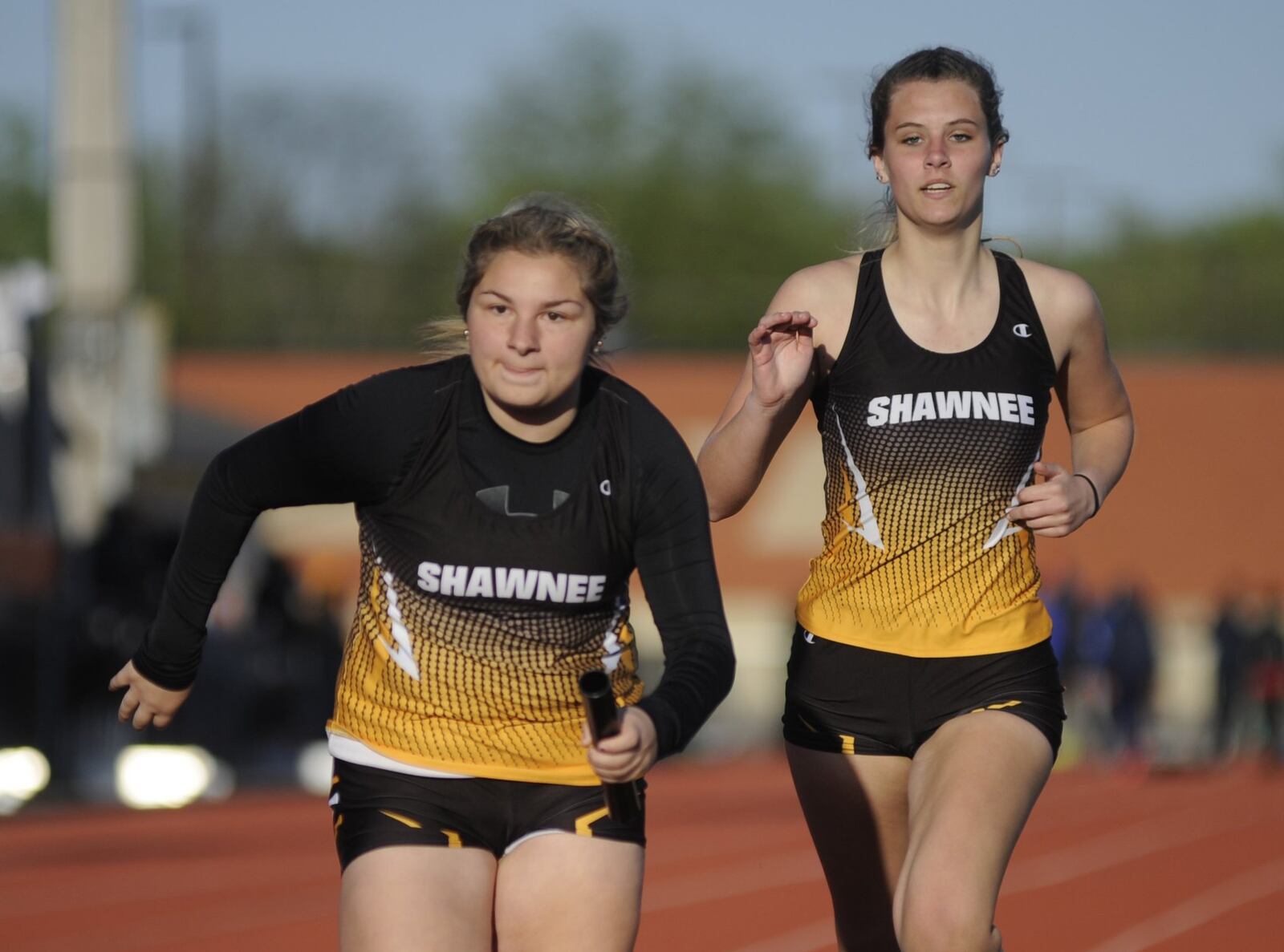 Shawnee’s Tori Malicki (rear) hands off to Mikynna Garberich in the girls 800 relay during the Wayne Inv. on Friday, April 26, 2019. MARC PENDLETON / STAFF