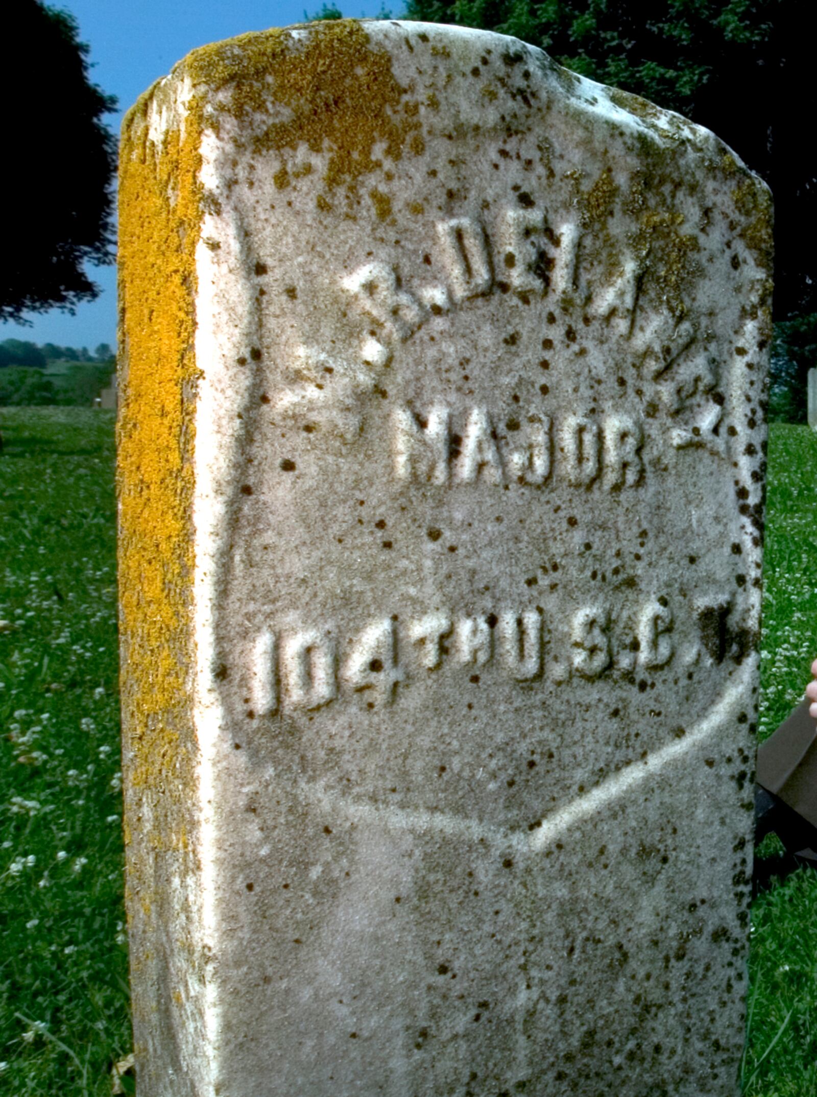 Dr. Floyd Thomas has helped oversee the purchase of a new memorial monument to Martin Delany that will be placed near this grave marker at Massies Creek Cemetery in Greene County. Delany was a doctor, judge, commissioned officer, lawyer and political activist during the Civil War era.  Photo by Lisa Powell