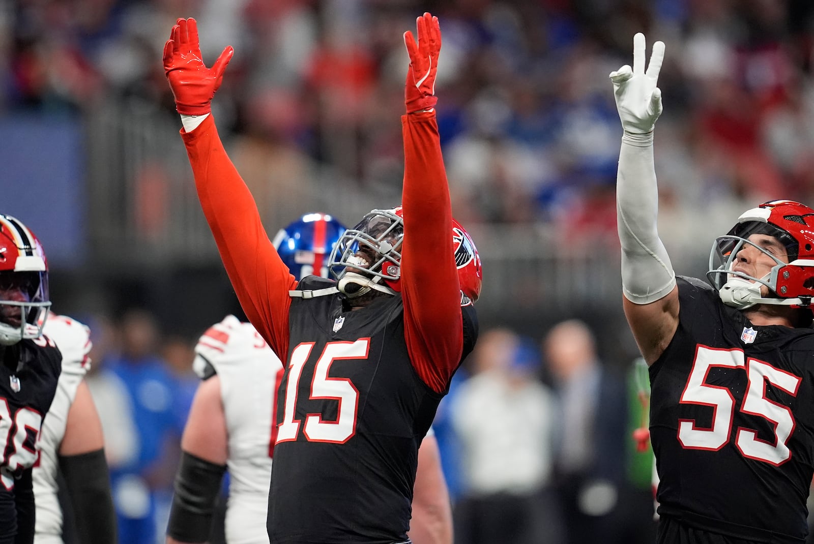 Atlanta Falcons' Matthew Judon celebrates sacking New York Giants quarterback Drew Lock (2) in the second half of an NFL football game in Atlanta, Sunday, Dec. 22, 2024. (AP Photo/Mike Stewart)