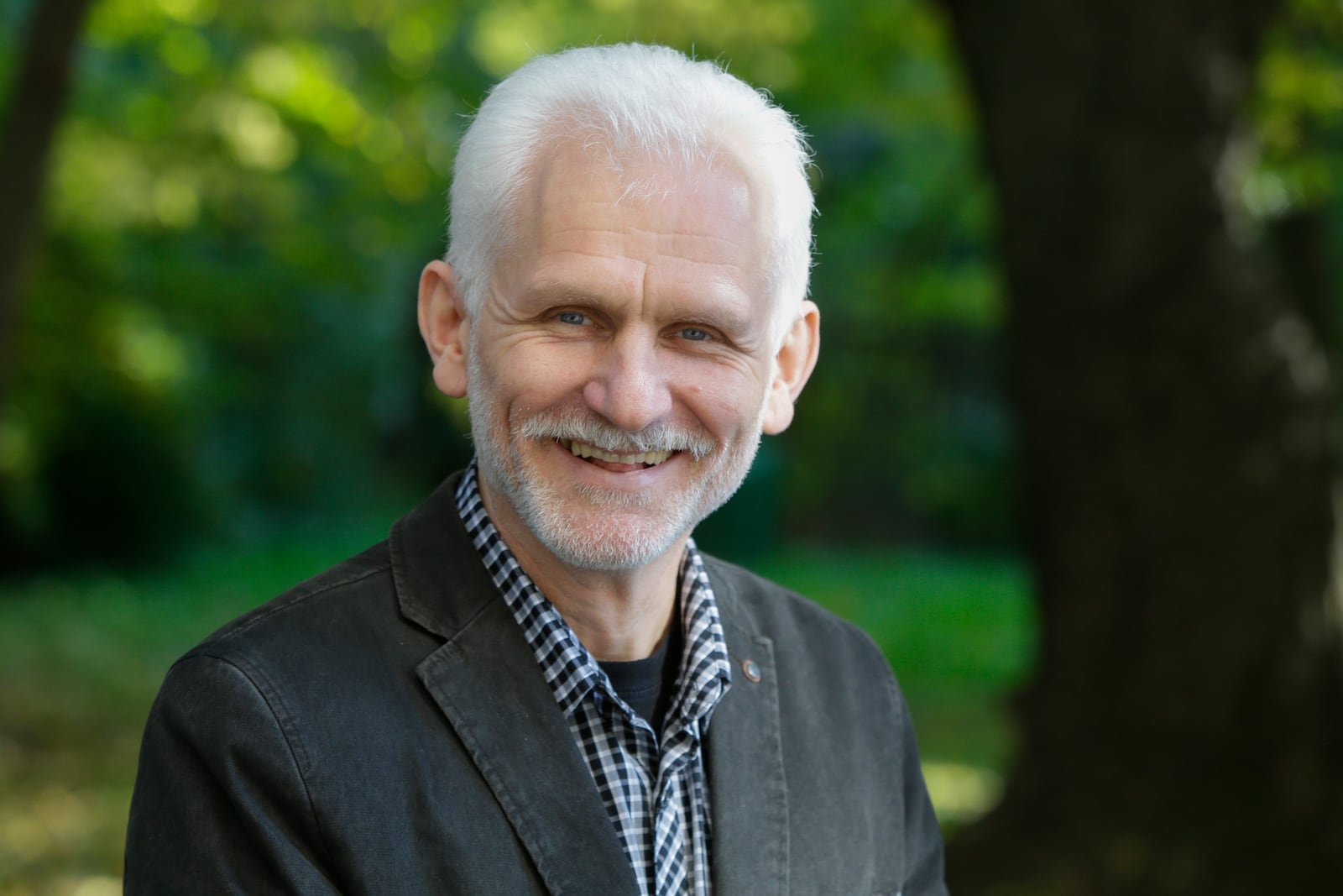 FILE - Ales Bialiatski, the head of the Viasna human rights group, poses for a photo in Minsk, Belarus, Oct. 7, 2014. (AP Photo, File)