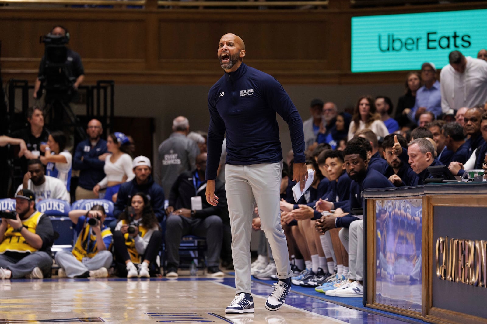 Maine head coach Chris Markwood shouts towards the court during the first half of an NCAA college basketball game against Duke in Durham, N.C., Monday, Nov. 4, 2024. (AP Photo/Ben McKeown)